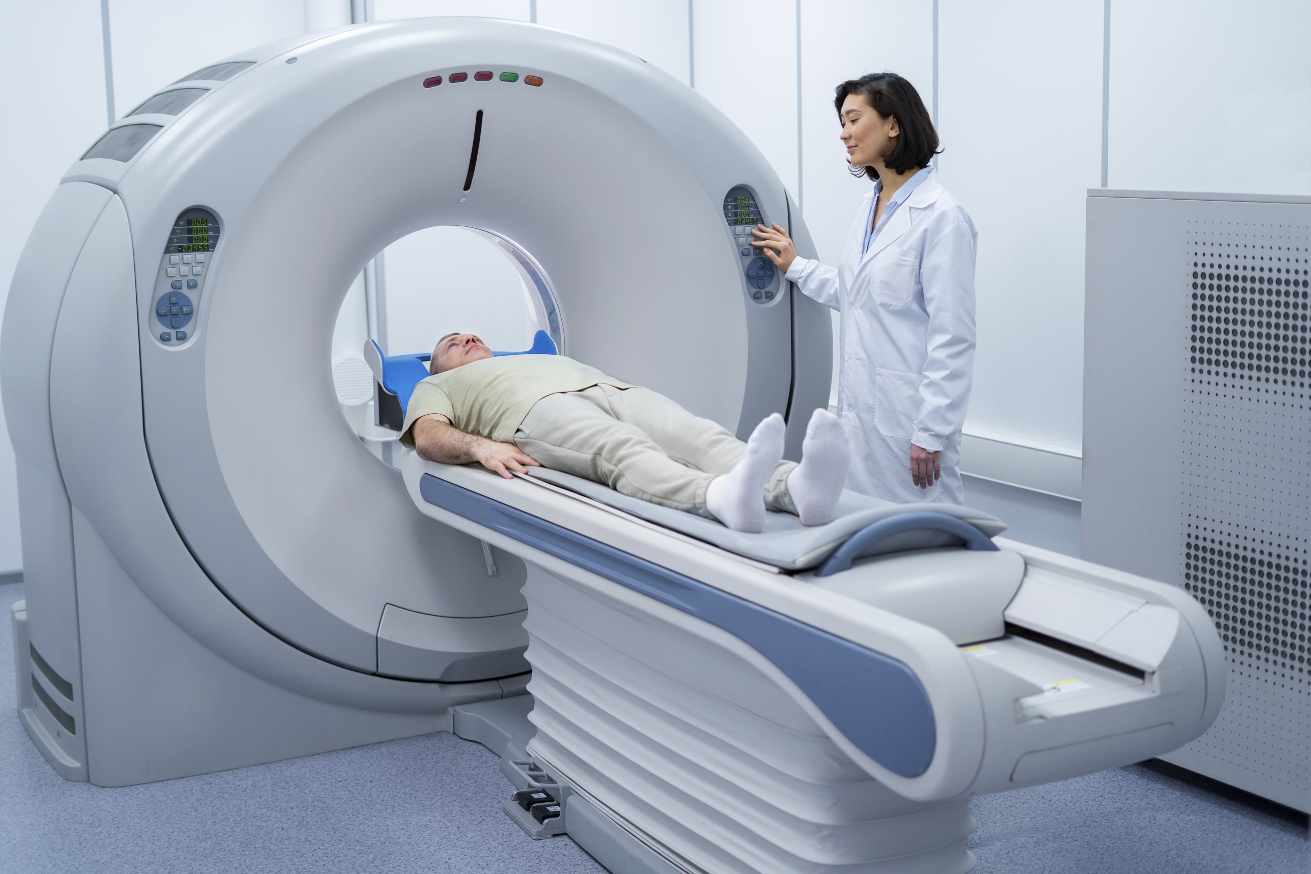 doctor-getting-patient-ready-ct-scan-scaled
