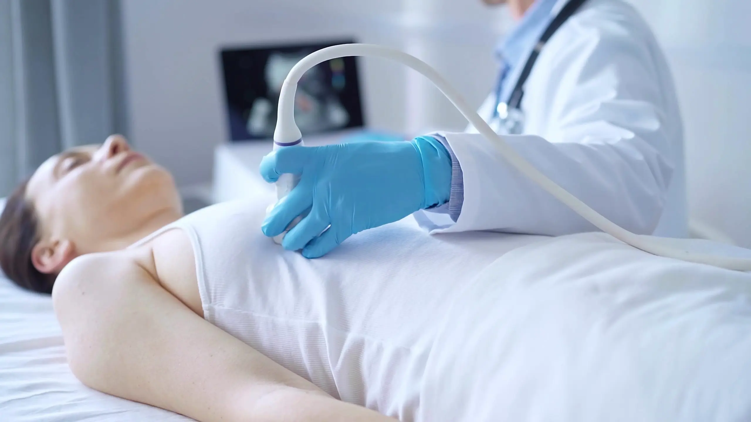 Philippines Breast Ultrasound Equipment Market Outlook to 2035 doctor-man-wearing-white-medical-gloves-is-using-ultrasound-equipment-breast-female-patient-female-breast-cancer-prevention-medicine-concept-scaled
