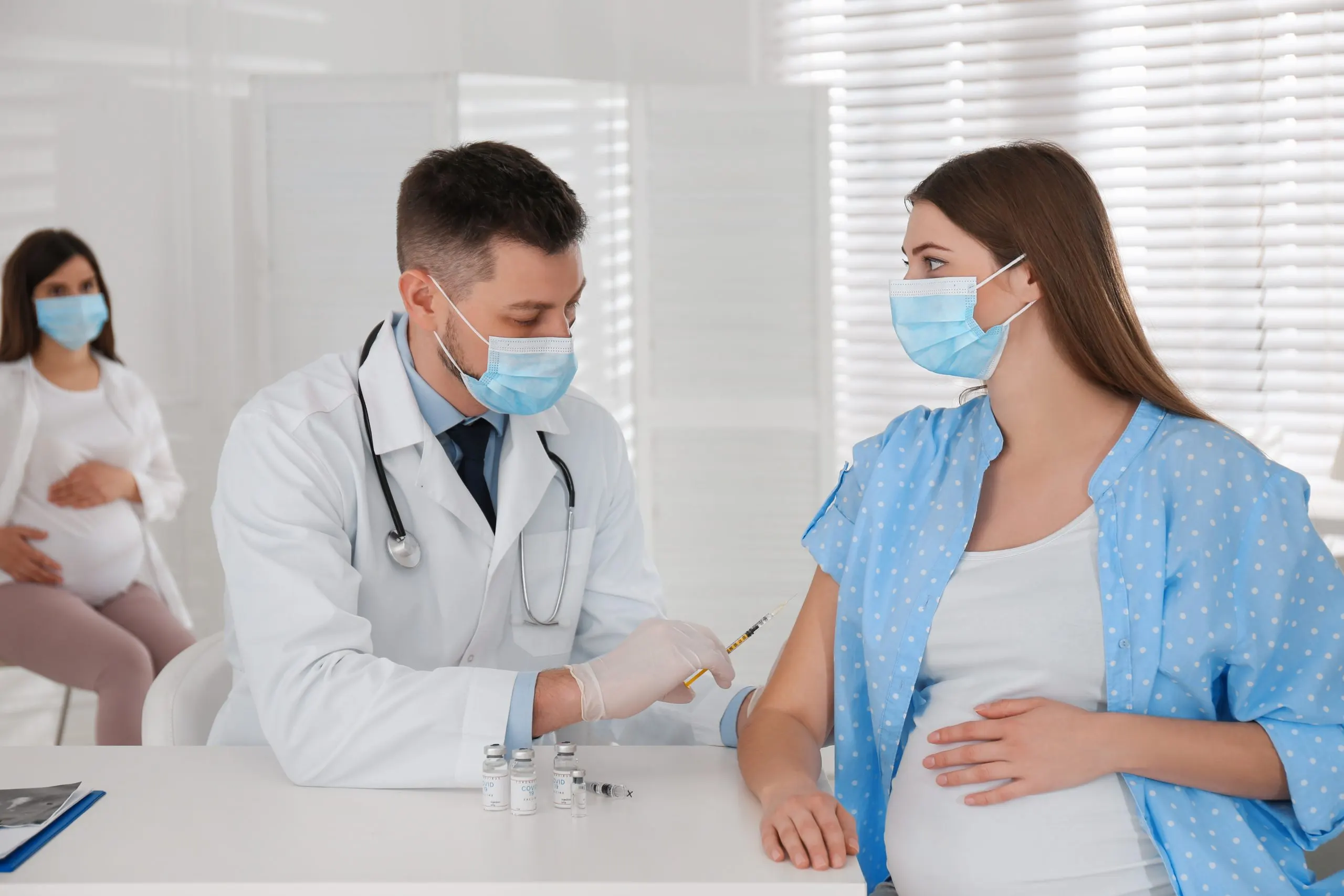KSA Midstream Pregnancy Tests Market Outlook 2035 doctor-vaccinating-pregnant-woman-against-covid19-clinic-scaled