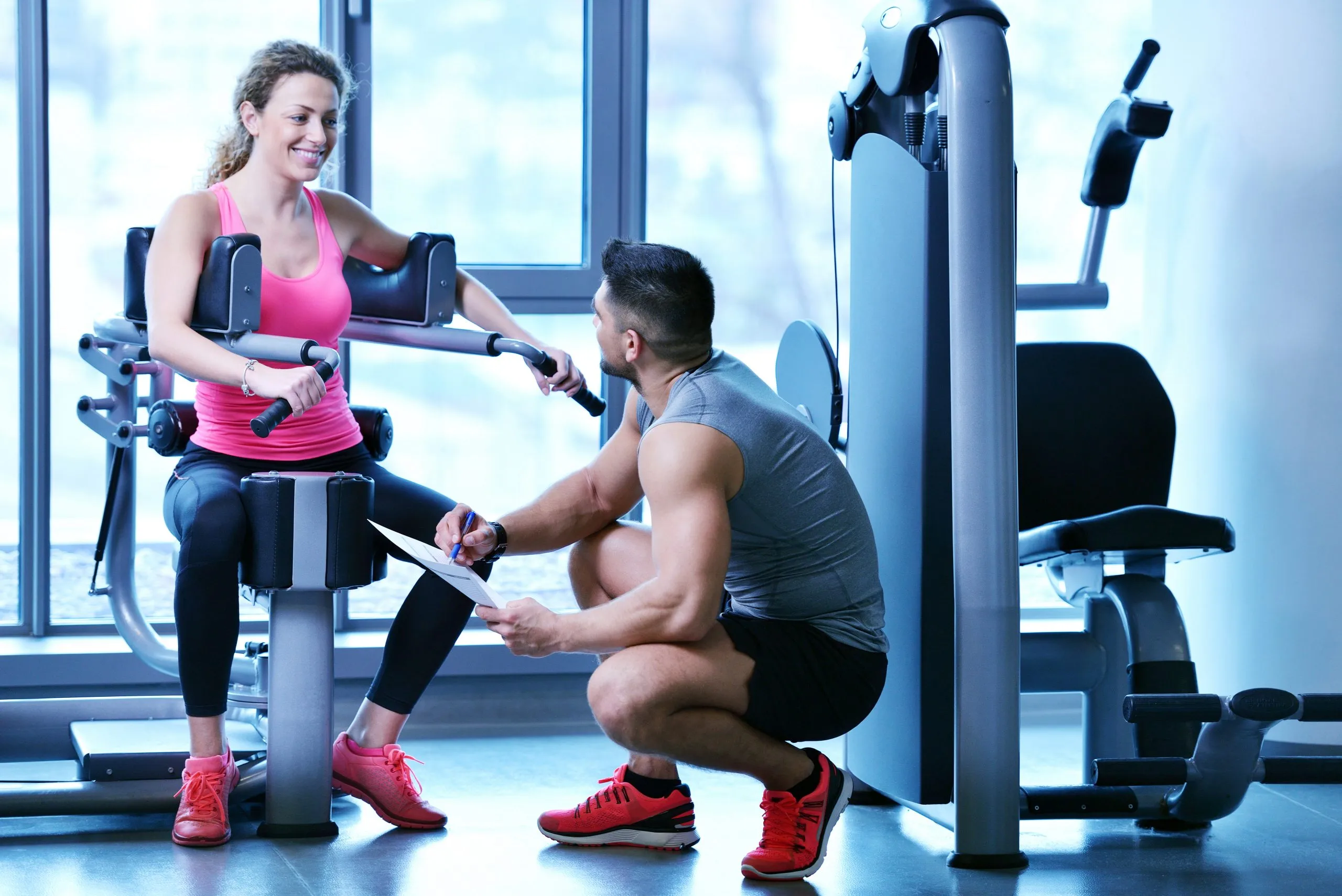 South Africa health and fitness services Market Outlook to 2035 gym-woman-exercising-with-her-personal-trainer-scaled