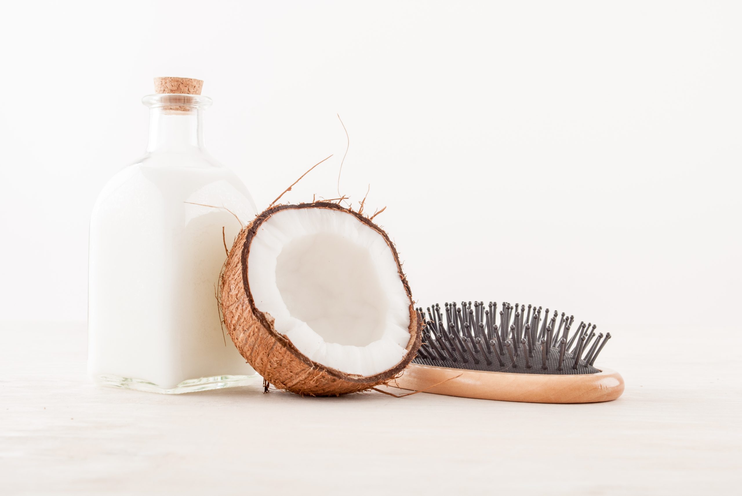 hair-care-concept-with-coconut-oil-white-background-scaled