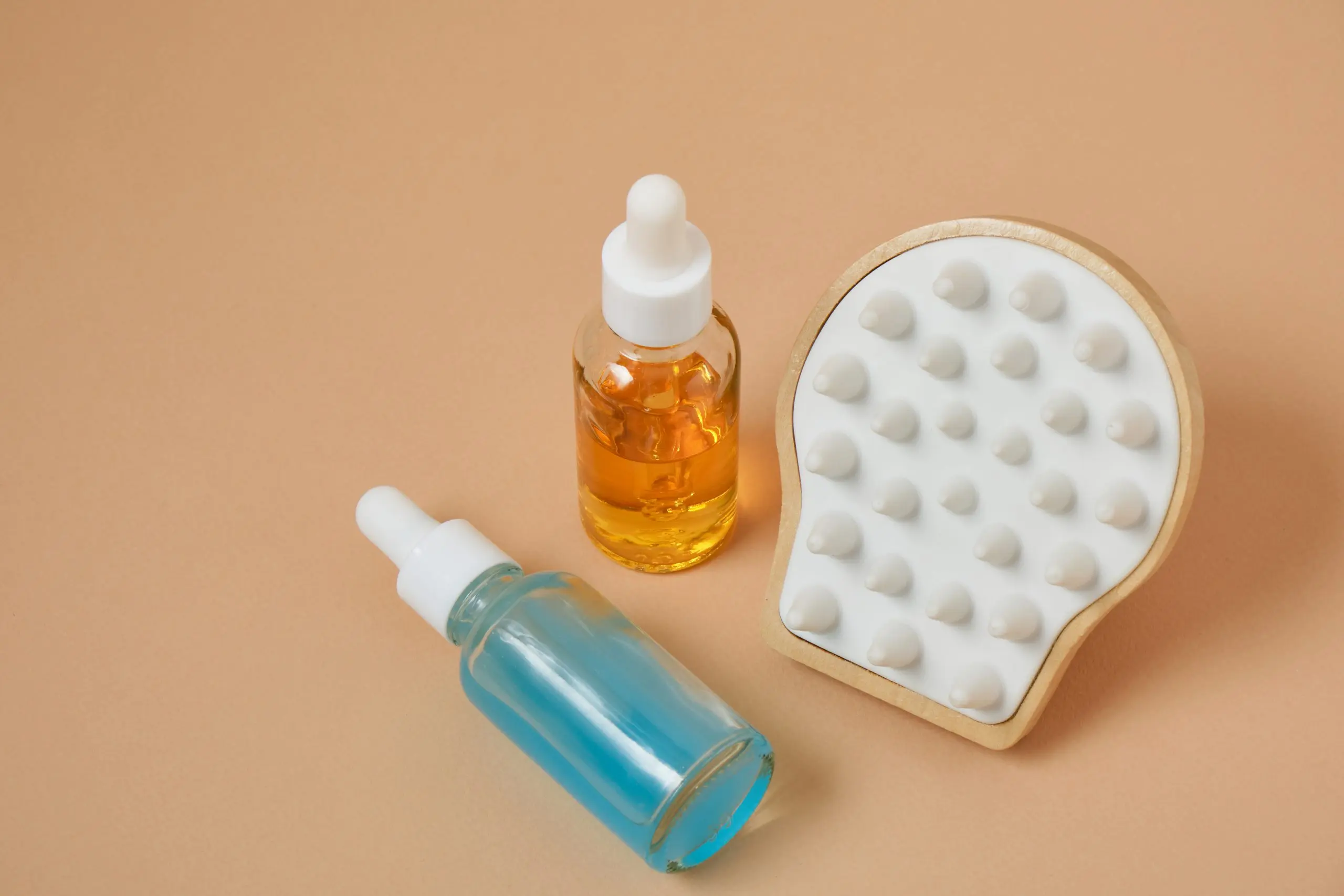 UK Hair Loss Treatment Products Market Outlook to 2035 hair-growth-product-massager-beige-background-scalp-baldness-treatment-hair-loss-concept-scaled
