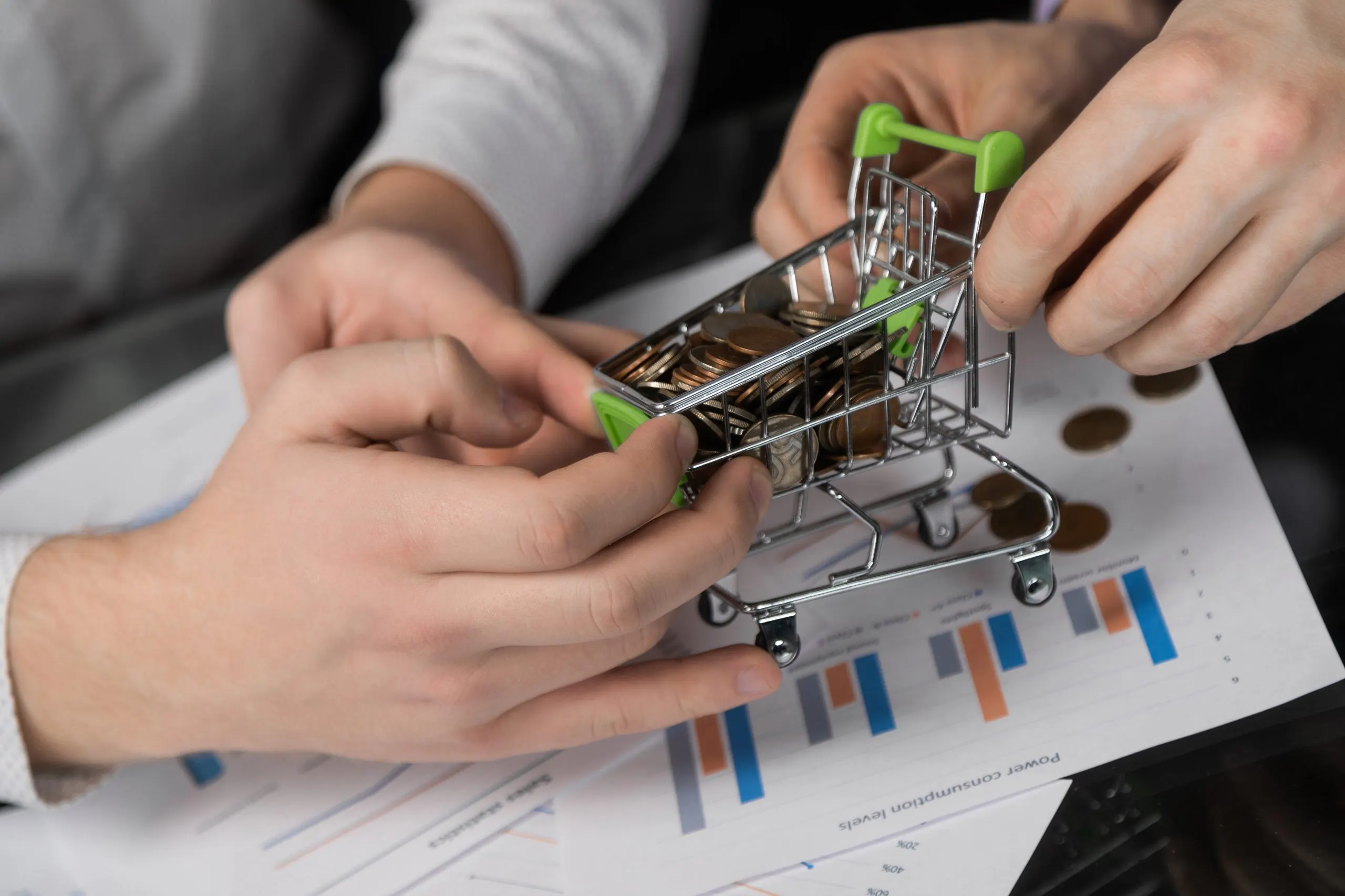 Qatar Advanced Materials Industry and the Rise of High-Performance Materials with 6–7% Global CAGR Growth men-s-hands-pulled-different-directions-dummy-shopping-cart-filled-with-coins-scaled