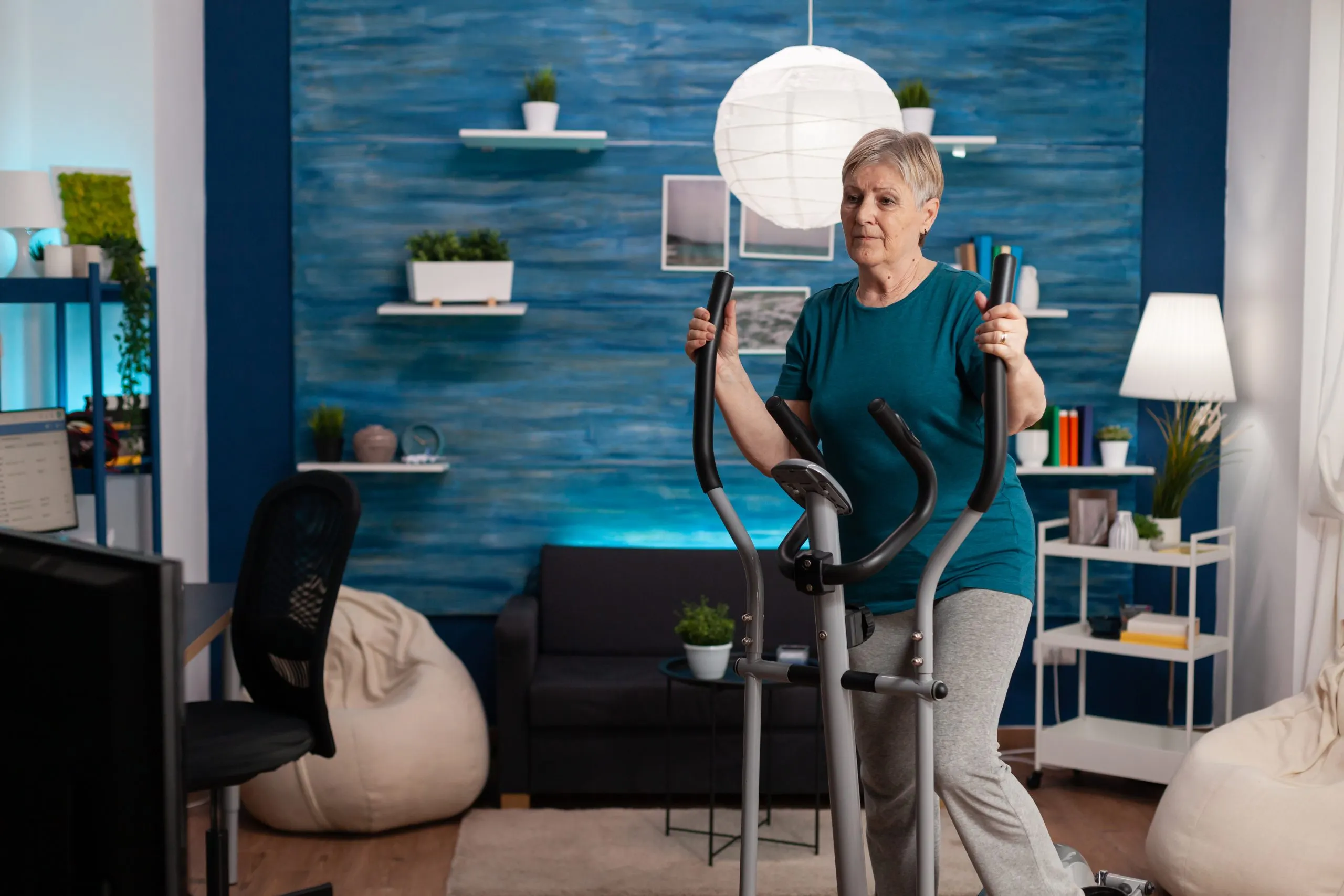 UAE Home Fitness Equipment Market Outlook to 2035 senior-woman-doing-aerobics-cycling-bike-machine-living-room-well-being-scaled