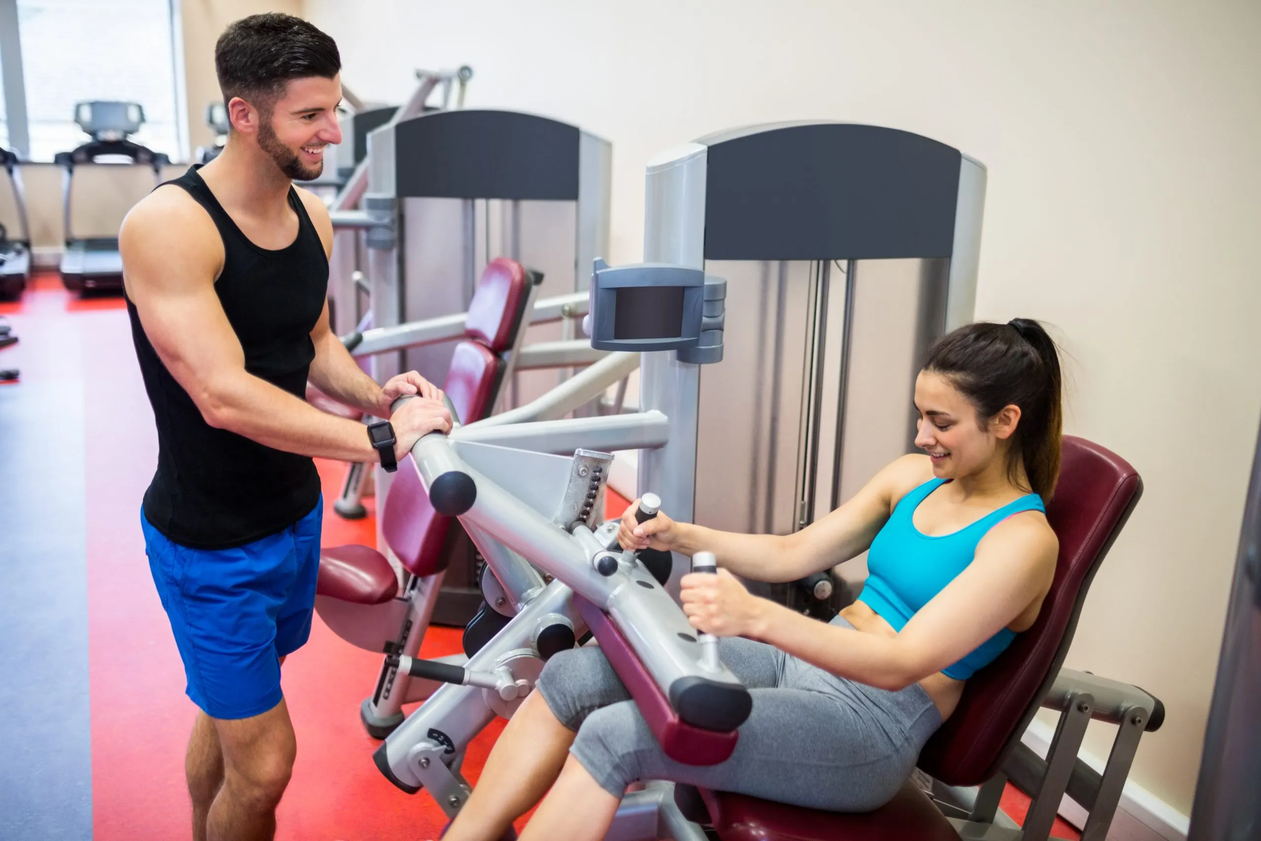 Philippines health and fitness services Market Outlook to 2035 smiling-woman-sitting-weights-machine-scaled