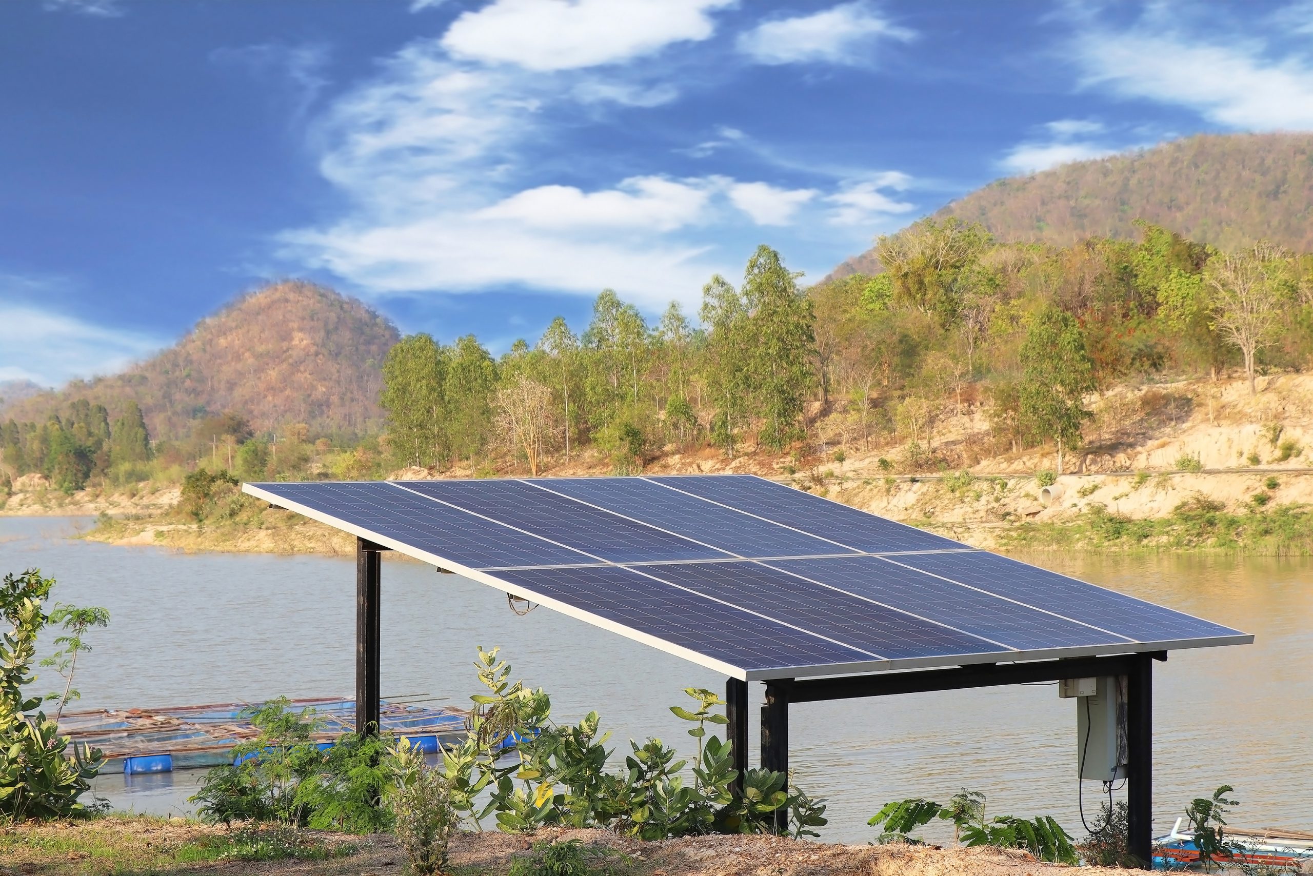solar-panels-pumping-water-supply-beside-reservoir-rural-area-scaled