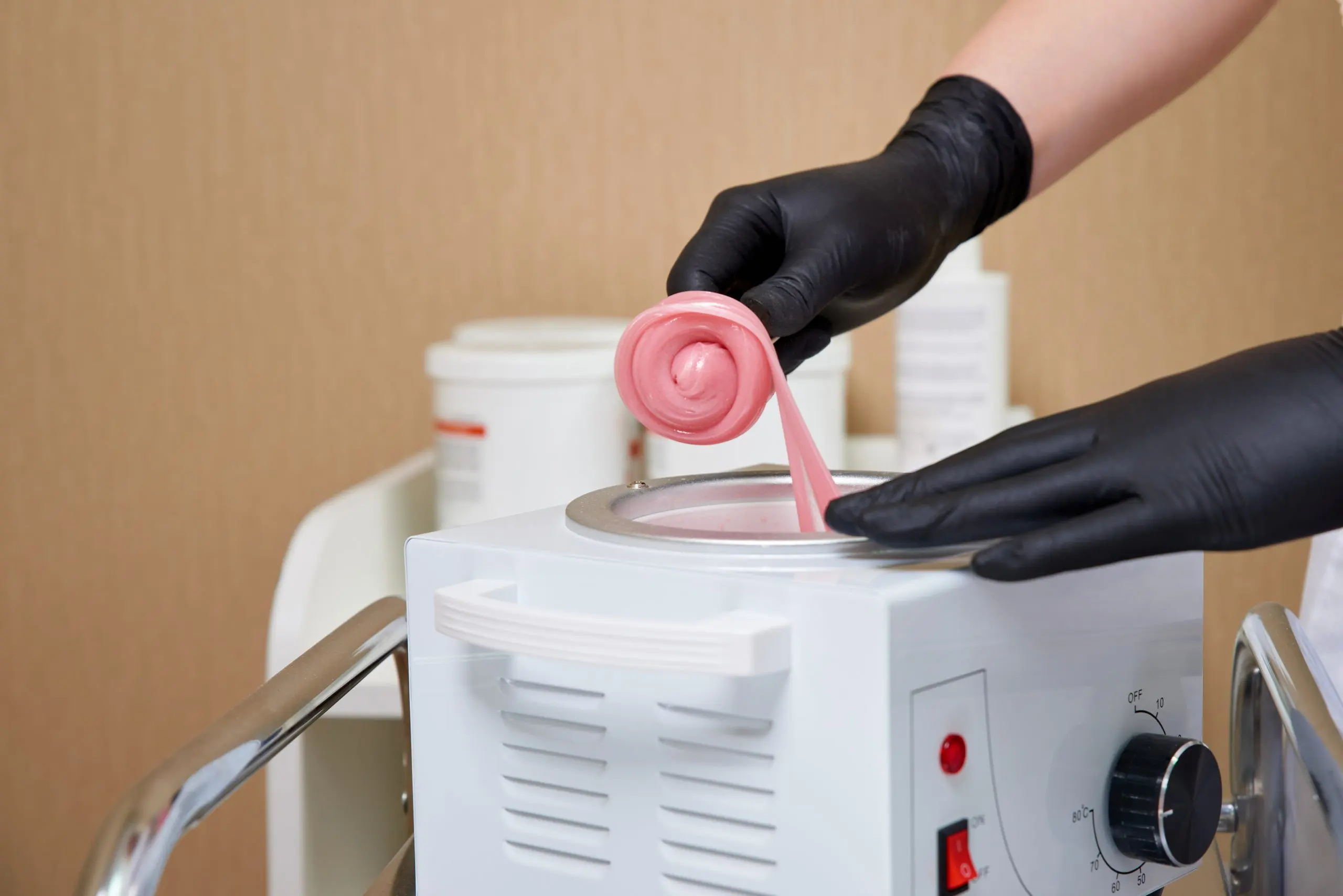 Philippines Waxing Devices Market Outlook 2035 wax-heater-with-hot-yellow-wax-wooden-spatula-human-hand-hot-wax-depilation-salon-equipment-scaled