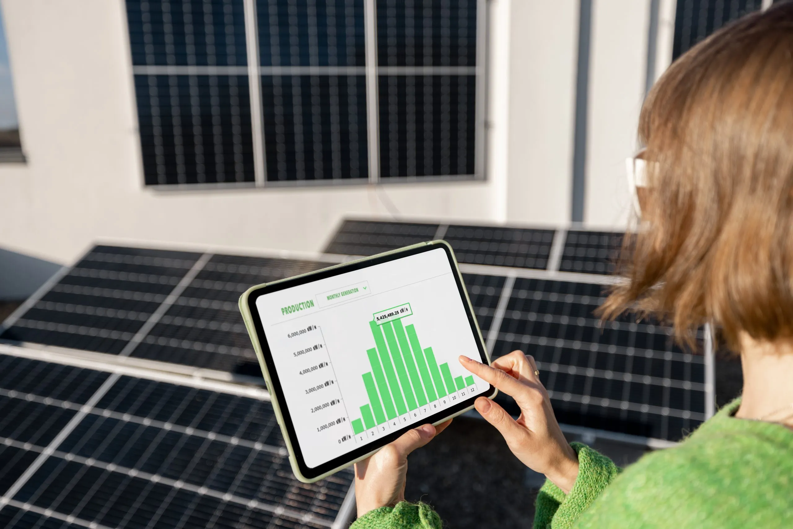 Qatar Solar EPC Market Outlook with Trends to 2035 and Beyond Driven by 8% Growth and Energy Goals woman-monitors-energy-production-from-solar-power-plant-with-digital-tablet-scaled
