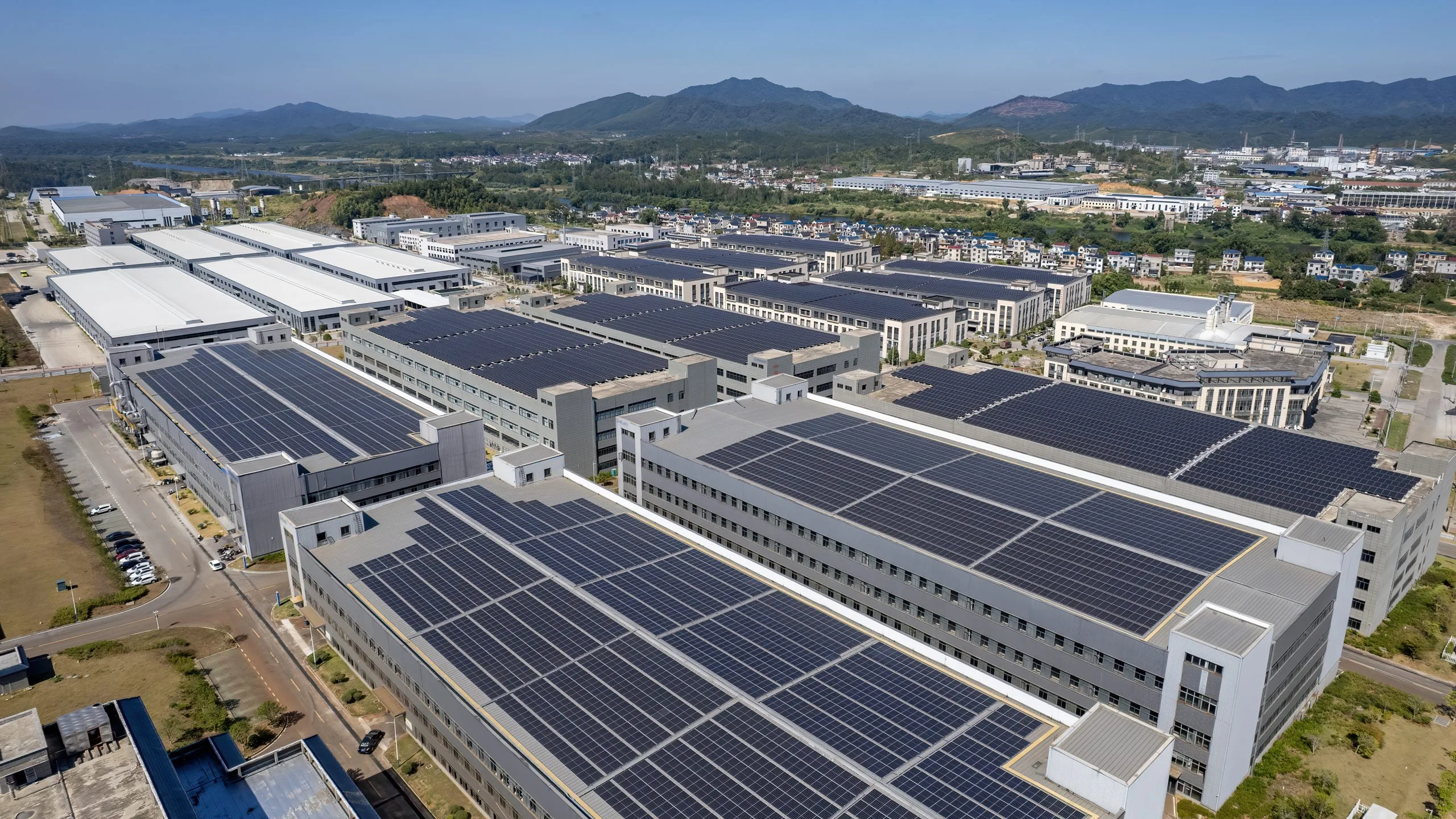 Driving Growth in the U.S. Solar PV Industry, Trends, Challenges, and Opportunities with 30% Annual Growth aerial-view-industrial-buildings-with-solar-panels-rooftops-scaled