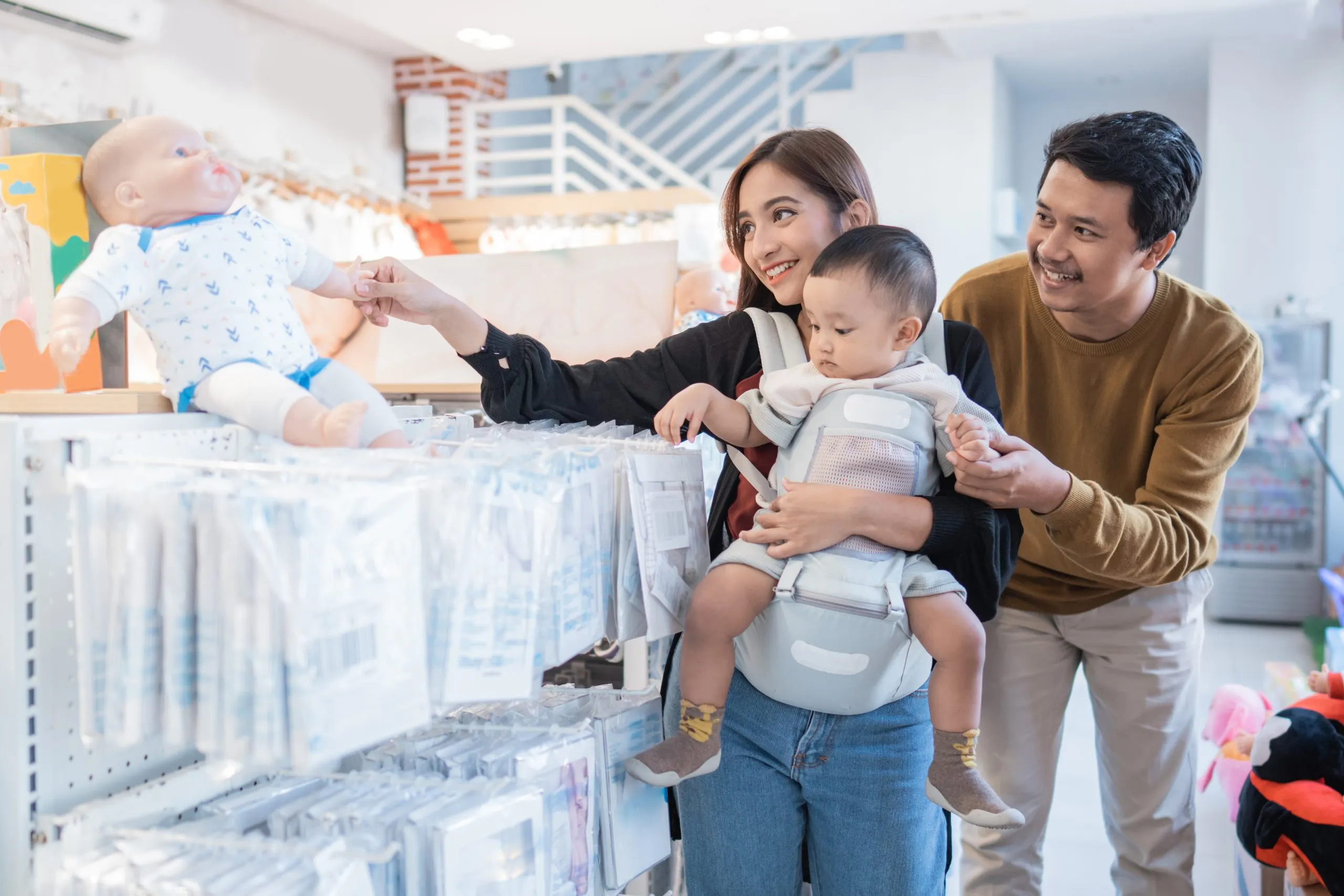 Brazil Baby Diapers Market Outlook to 2035 asian-family-with-kid-buying-baby-product-mall-scaled