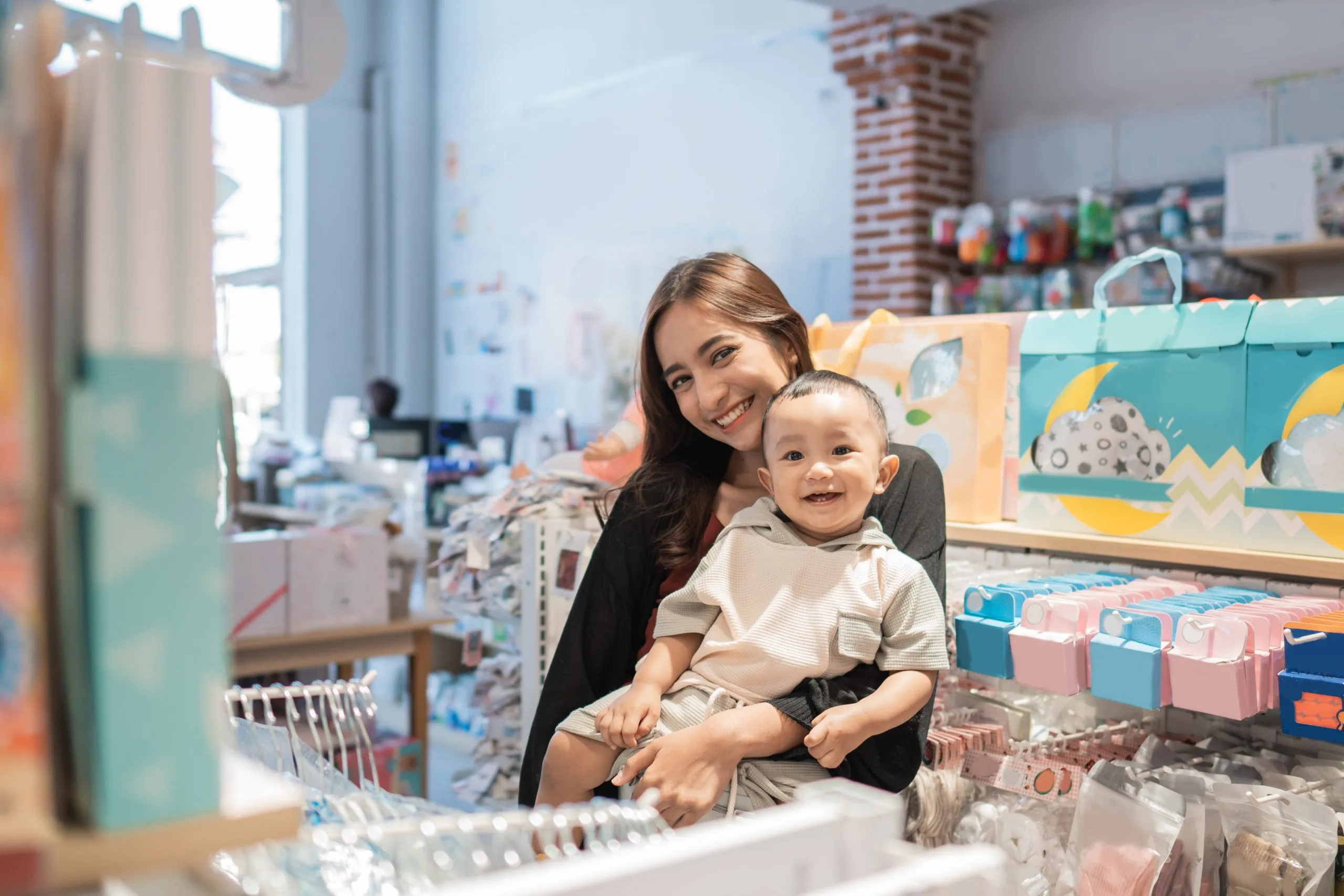 Singapore Baby Diapers Market Outlook to 2035 asian-mother-with-her-toddler-boy-shopping-baby-shop-1-scaled