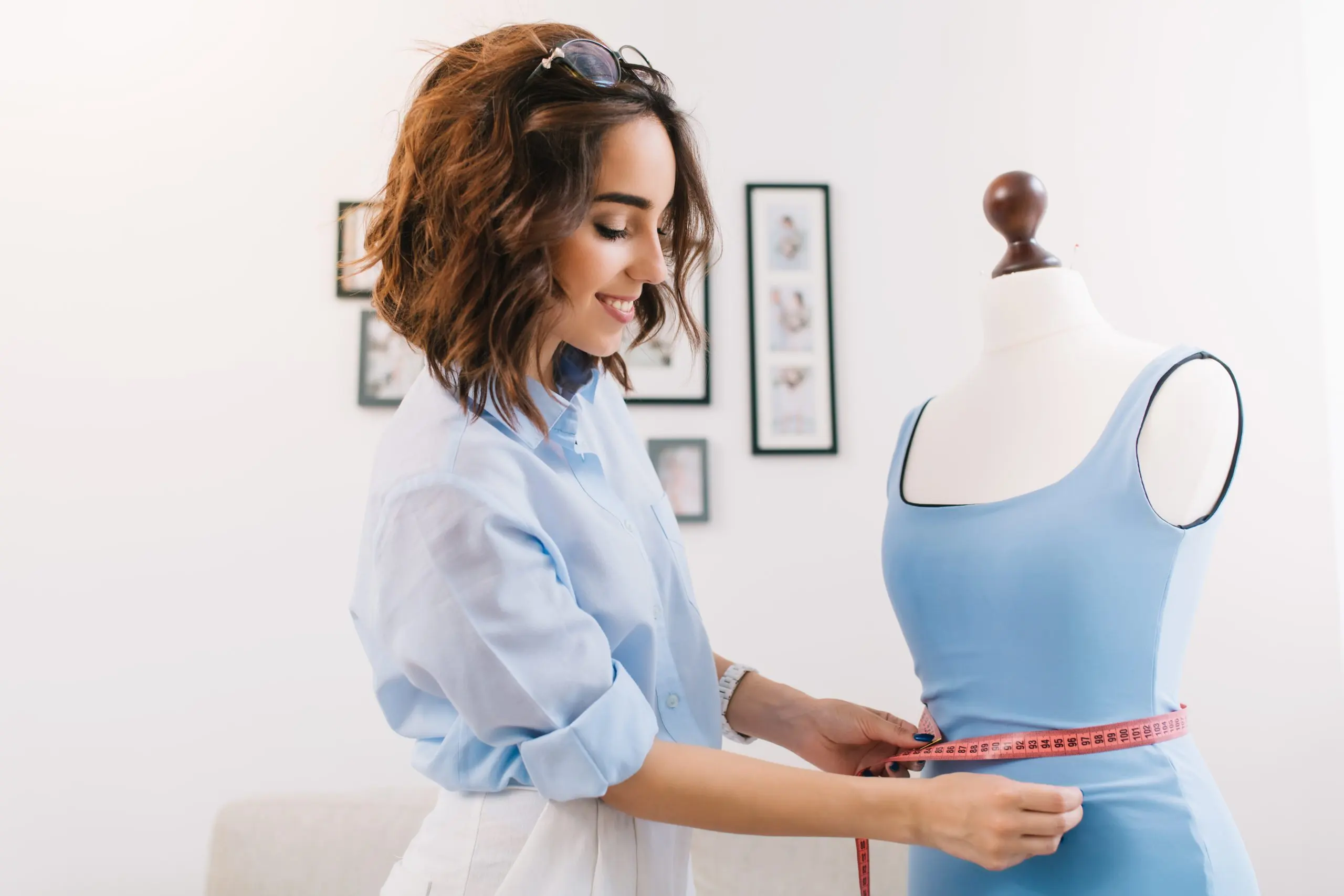 Shaping Trends in the South Africa Shapewear Market with $95M Revenue and 15% CAGR growth value brunette-girl-blue-shirt-is-working-workshop-studio-she-makes-fitting-blue-dress-mannequin-scaled