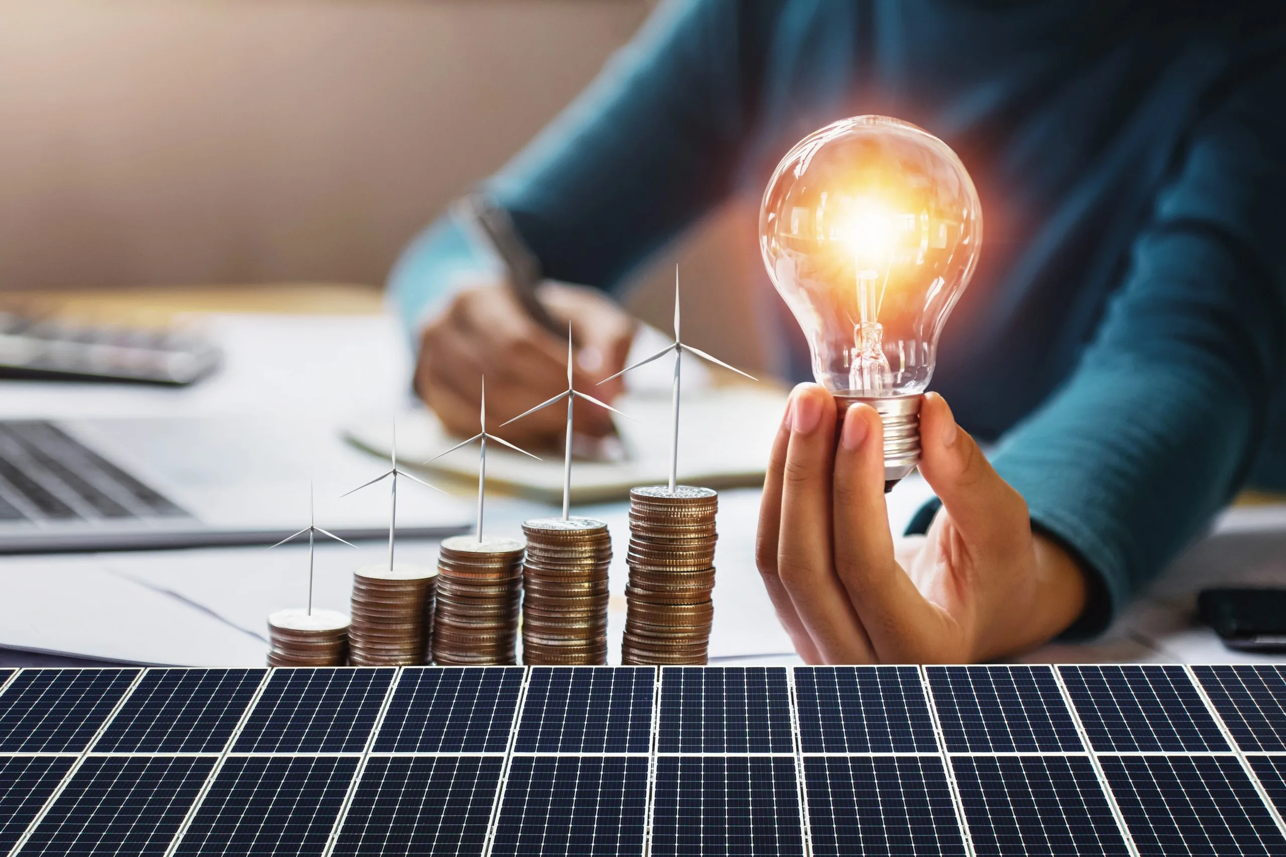 Germany’s Solar EPC Market Transforming the Sector with 50% Expansion in Solar Capacity businesswoman-holding-light-bulb-with-turbine-coins-solar-panel-concept-saving-energy-finance-accounting-scaled