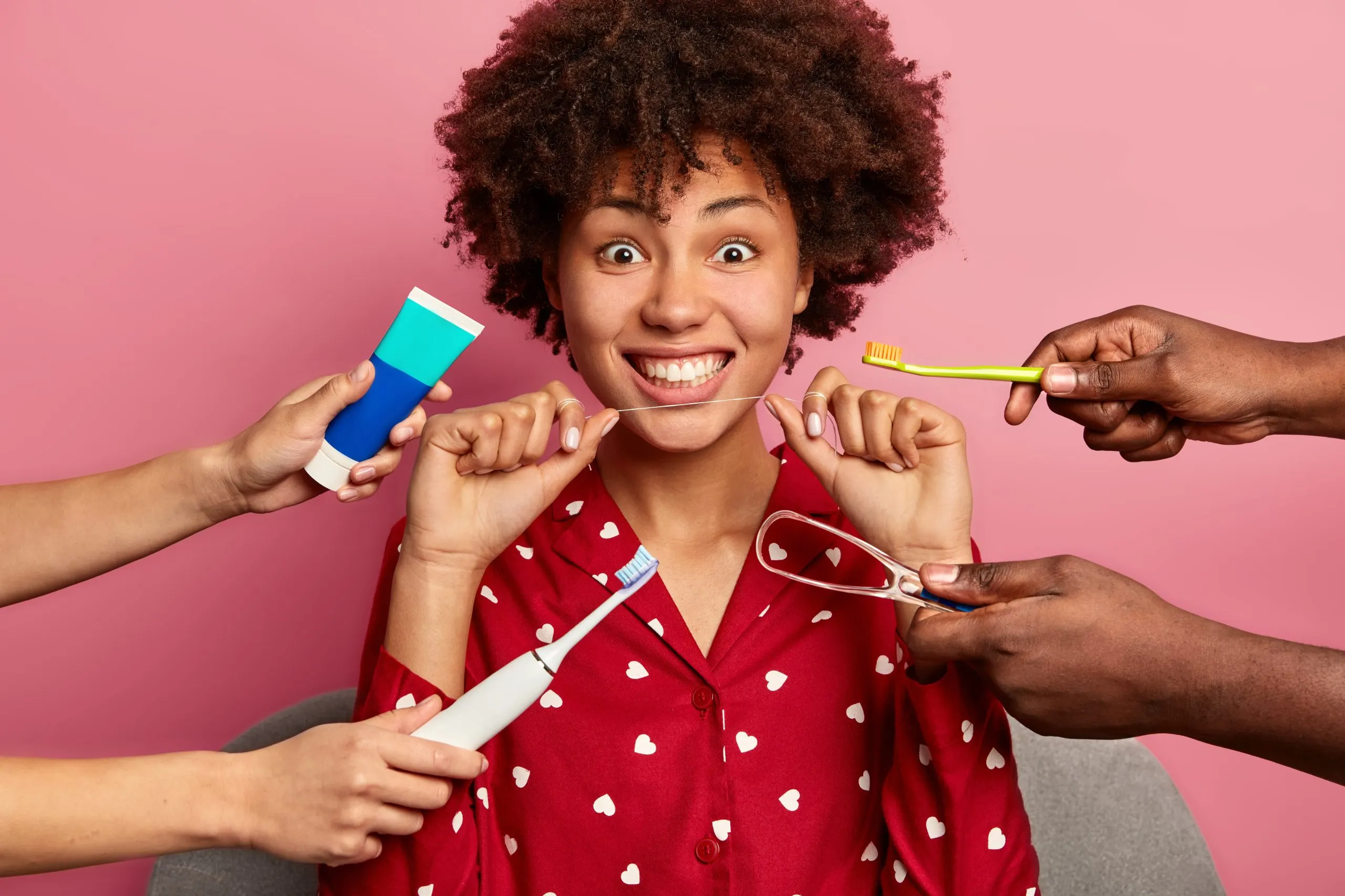 Singapore Oral Care Market Analysis Across Retail Channels with 1.07% CAGR Growth Outlook curly-woman-cares-about-teeth-holds-dental-floss-surrounded-by-toothpaste-brushes-1-scaled