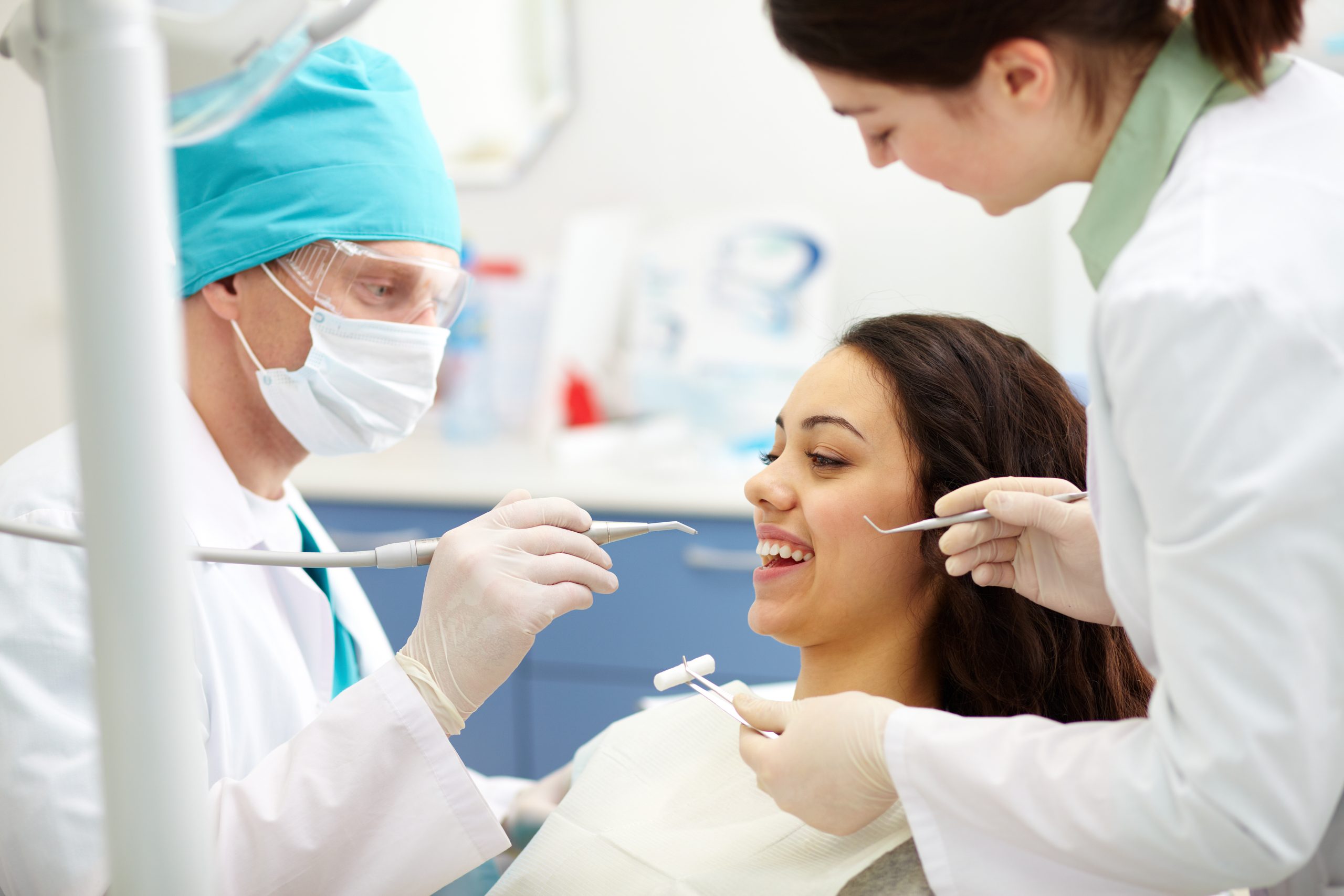 dentist-examining-patient-s-teeth-1-scaled
