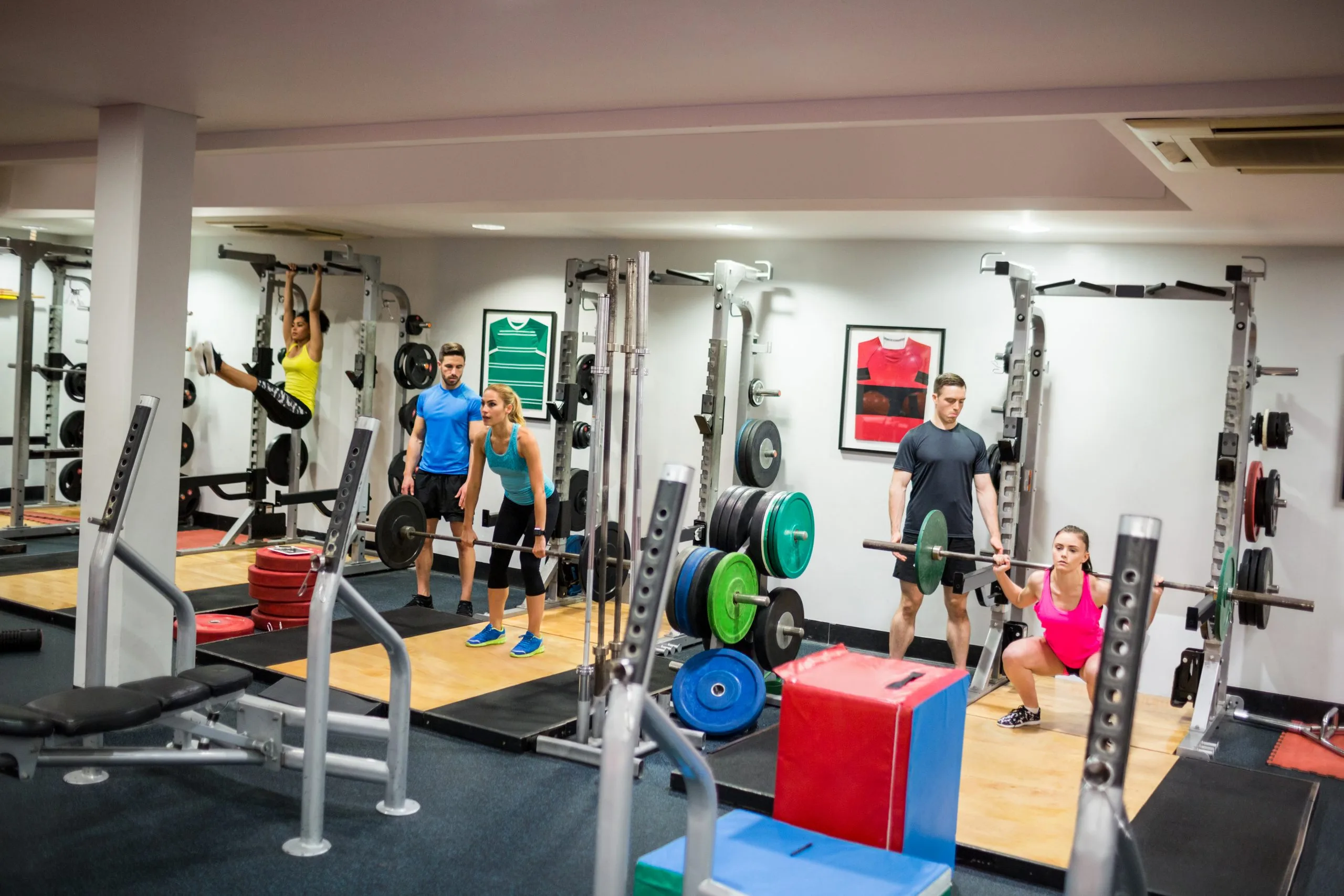 Philippines Health and Fitness Club Market Outlook to 2035 fit-people-working-out-weights-room-1-scaled