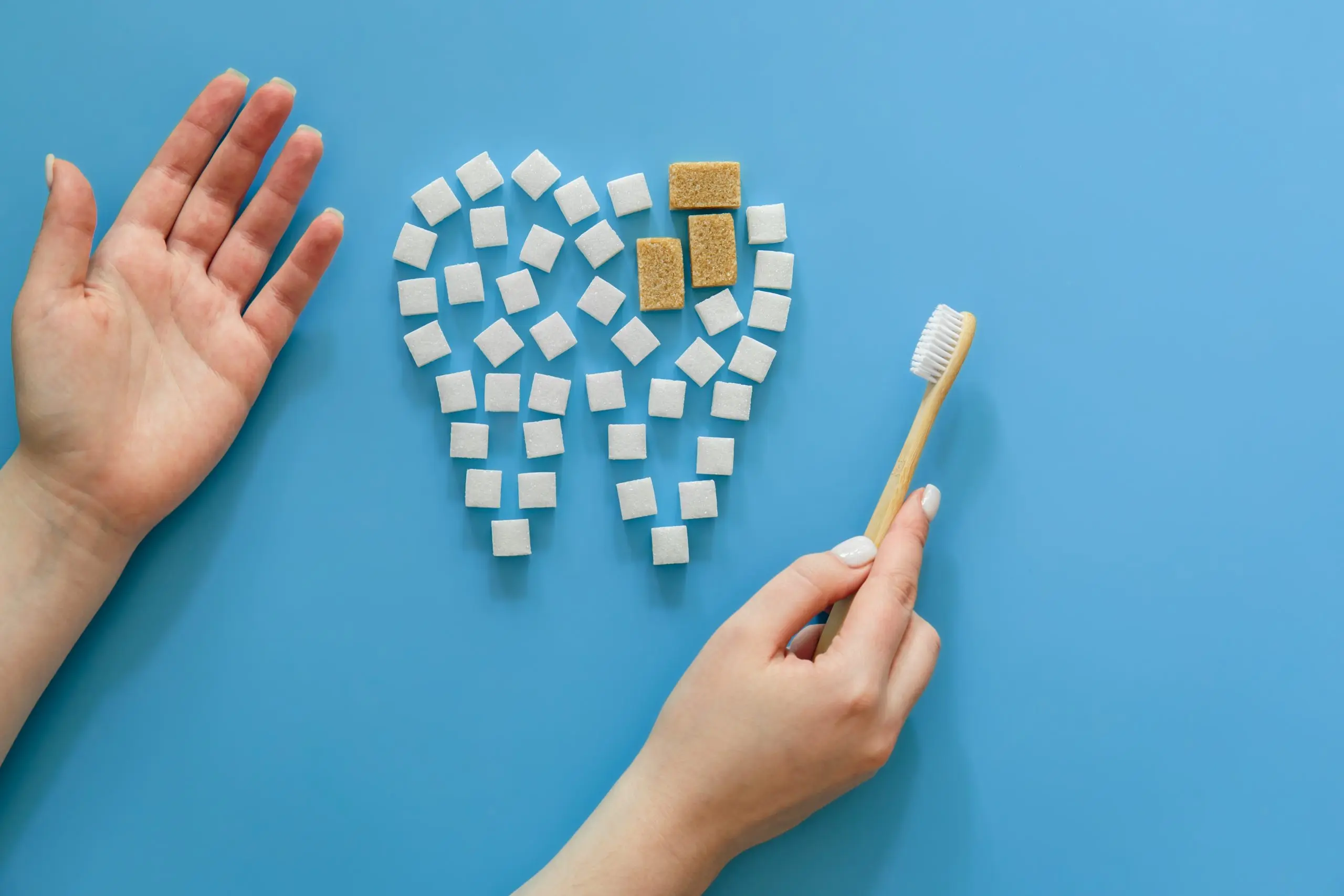 Nigeria Oral Care Market Set for Growth as Preventive Dental Care Drives 13.2% CAGR in Fluoride-Free Toothpaste flat-lay-tooth-made-sugar-blue-background-scaled