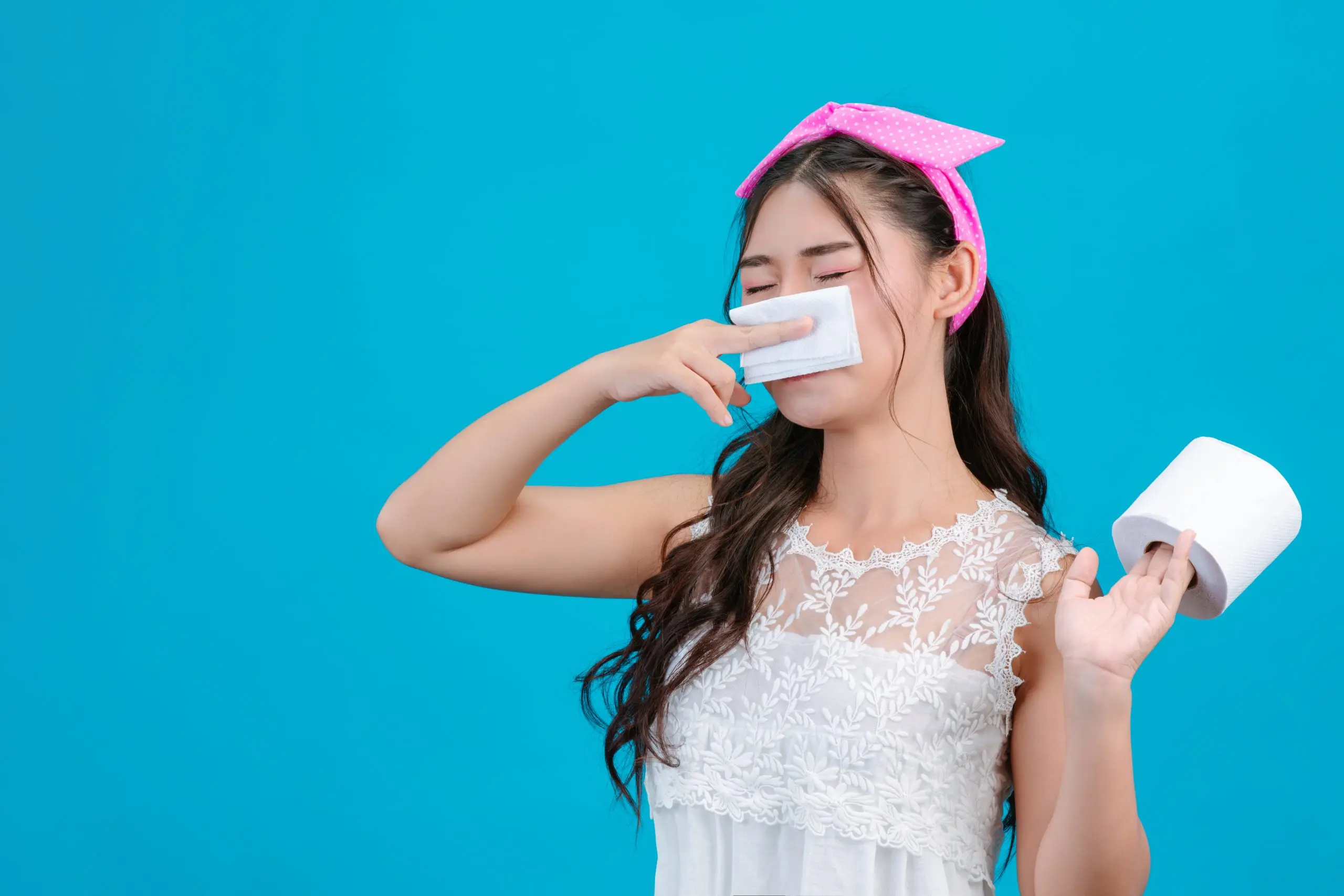 Philippines Feminine Wipes Market Outlook to 2035 girl-wearing-white-pajamas-is-comfortable-using-tissue-wipe-her-nose-blue-scaled