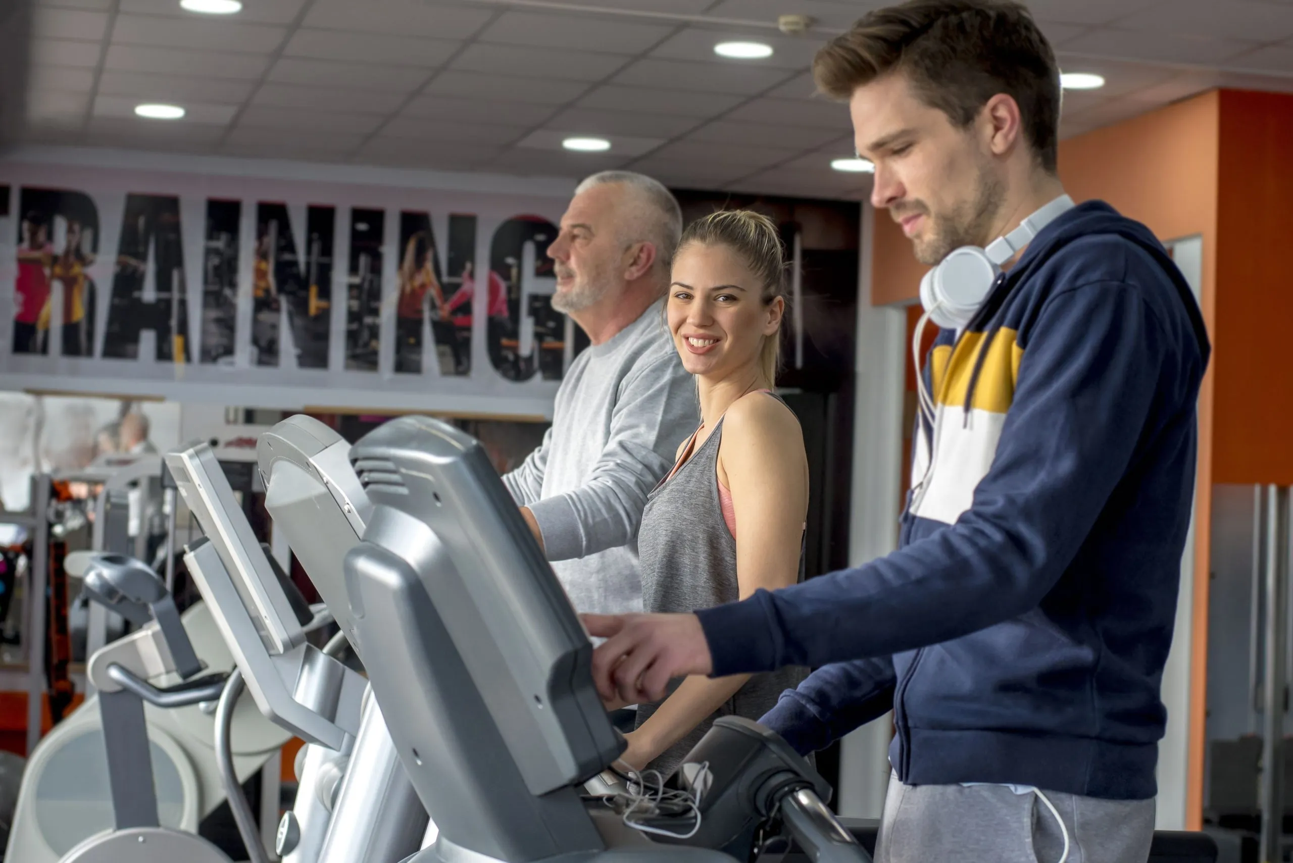 Philippines Health and Fitness Club Market Outlook with 8.5% CAGR, Membership Growth, and Rising Wellness Spending group-caucasian-friends-exercising-together-treadmills-gym-scaled