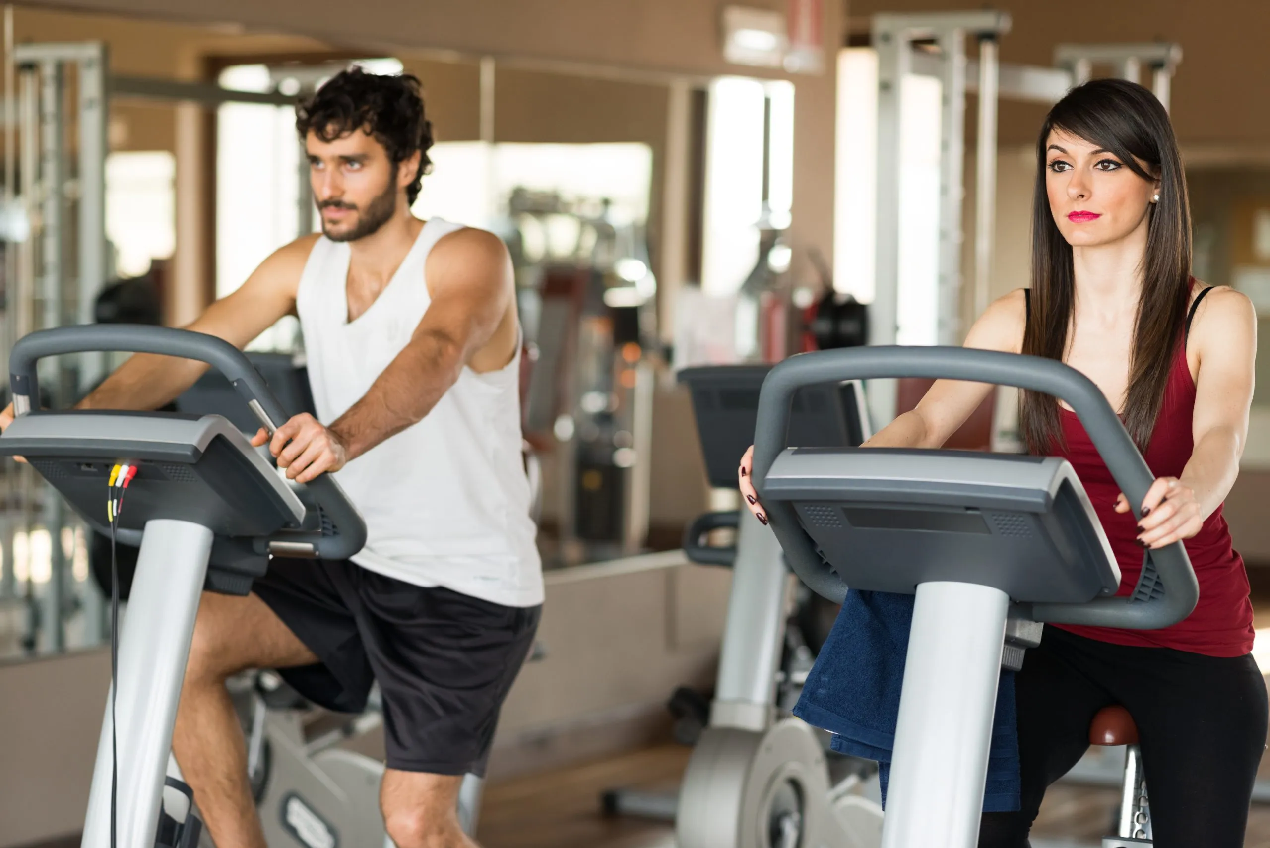 Vietnam Health and Fitness Club Market Outlook to 2035 group-people-working-out-stationary-bike-scaled