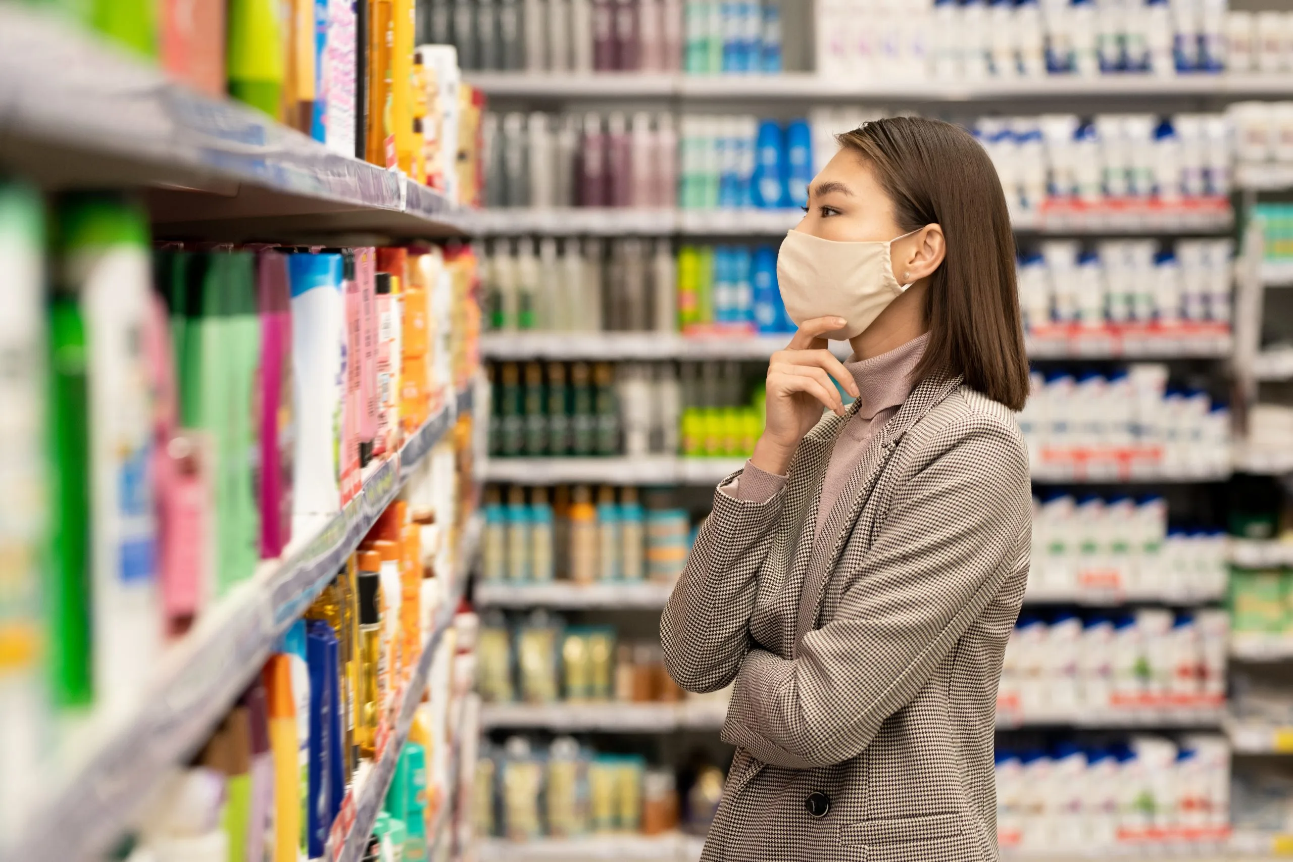 Vietnam Face Wash Market Outlook to 2035 hand-aged-female-consumer-taking-plastic-bottle-fresh-sour-dairy-drink-while-choosing-food-products-supermarket-scaled
