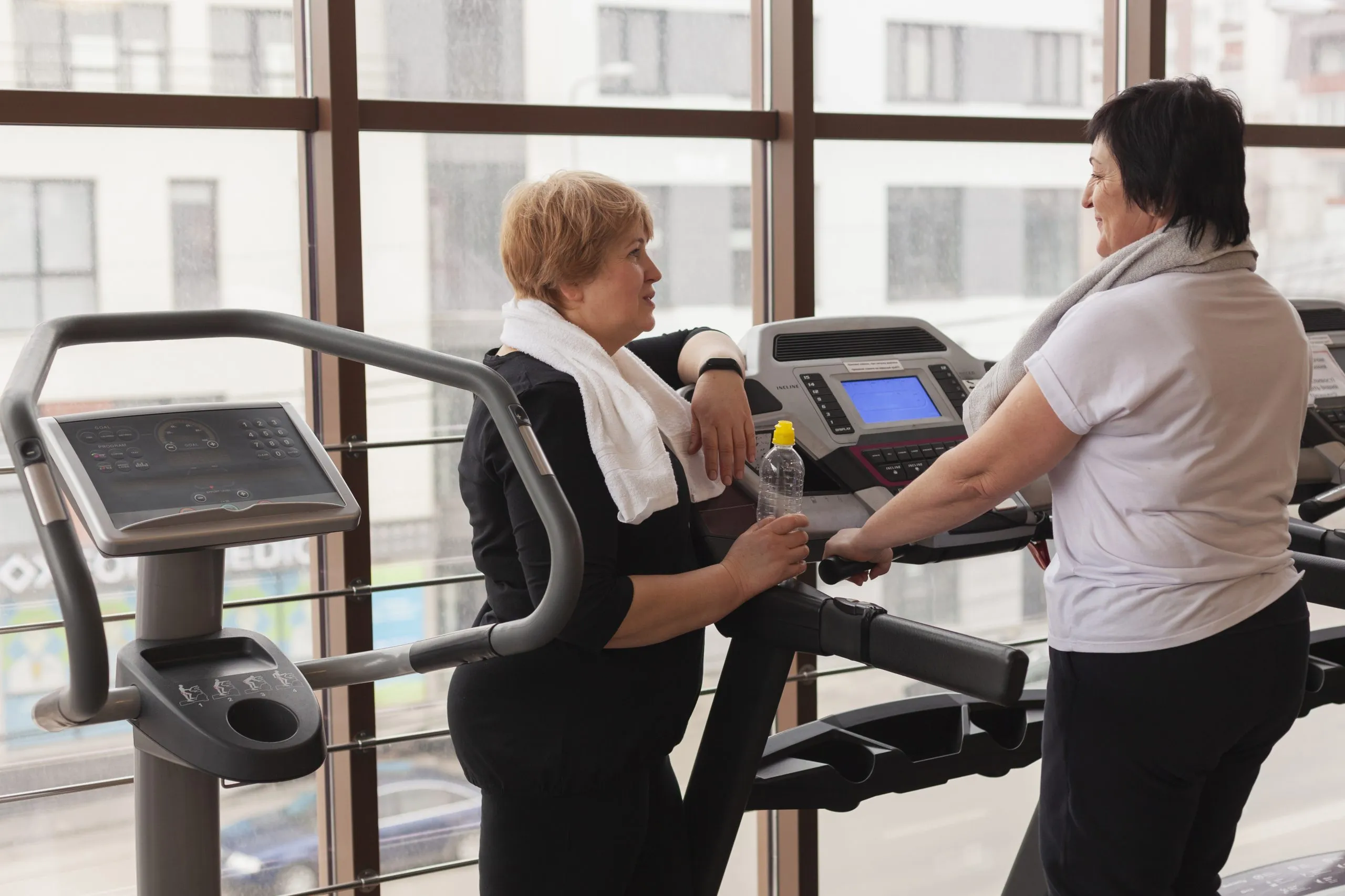 UAE Fitness Services Market Outlook Showing $3B Revenue and 9% CAGR Drivers and Opportunities high-angle-senior-women-working-treadmill-scaled