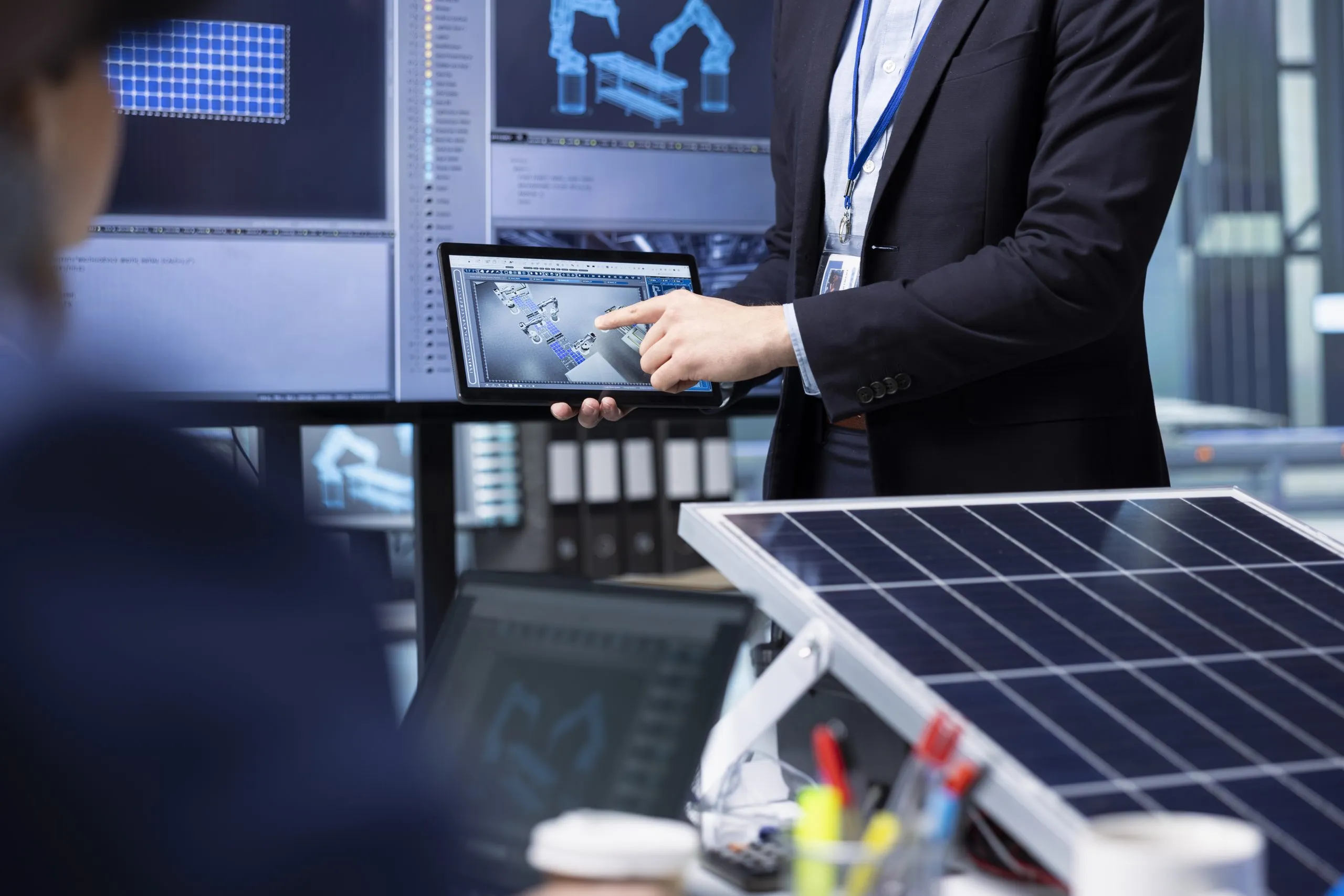 Nigeria Solar EPC Market on the Rise, Expected to Grow by 15% CAGR to $1.5 Billion in the coming years investors-examine-solar-panel-surface-using-tablet-discussing-design-efficiency-scaled