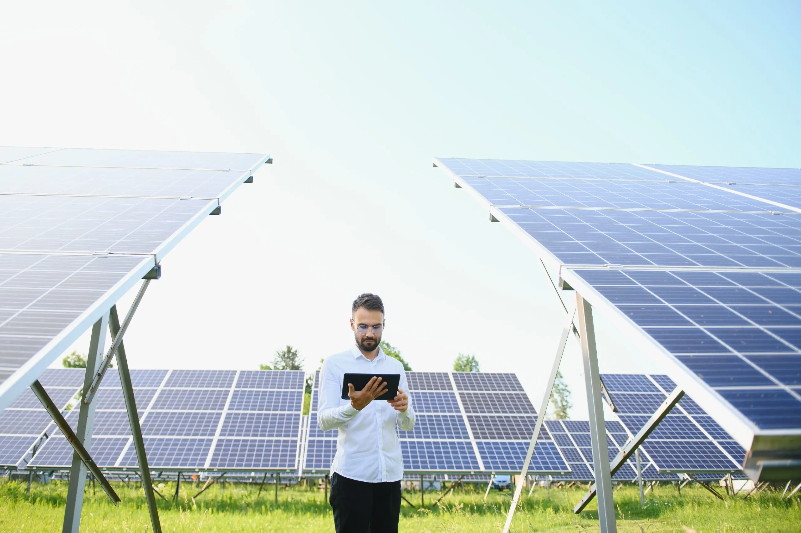 The Growth of France Solar EPC Market Driving 20 % Renewable Share in coming years male-worker-solar-power-plant-with-tablet-background-photovoltaic-panels-scaled