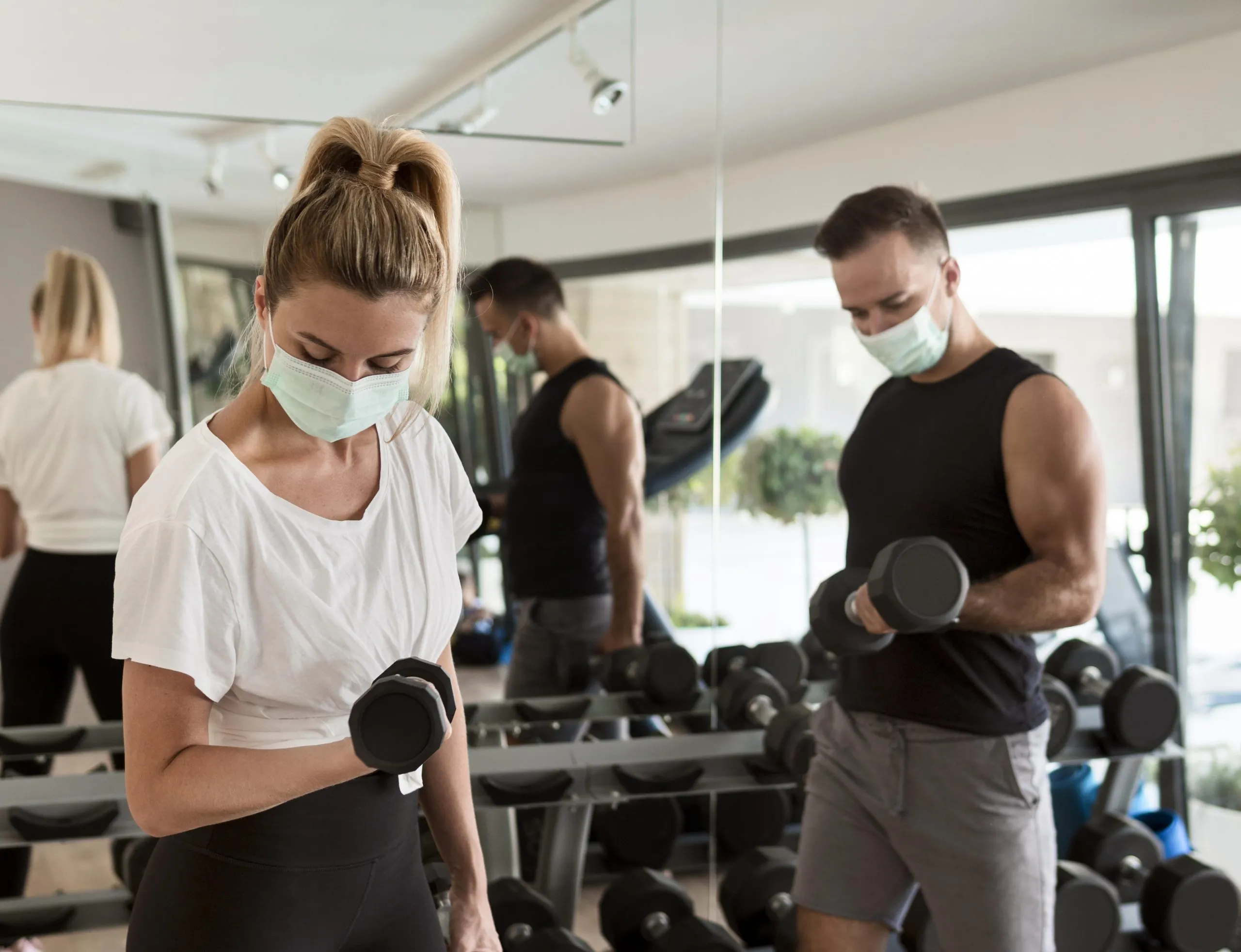UAE Health and Fitness Club Market Growth Supported by 1.2 Million Fitness Enthusiasts and Lifestyle Changes man-woman-working-out-together-gym-scaled
