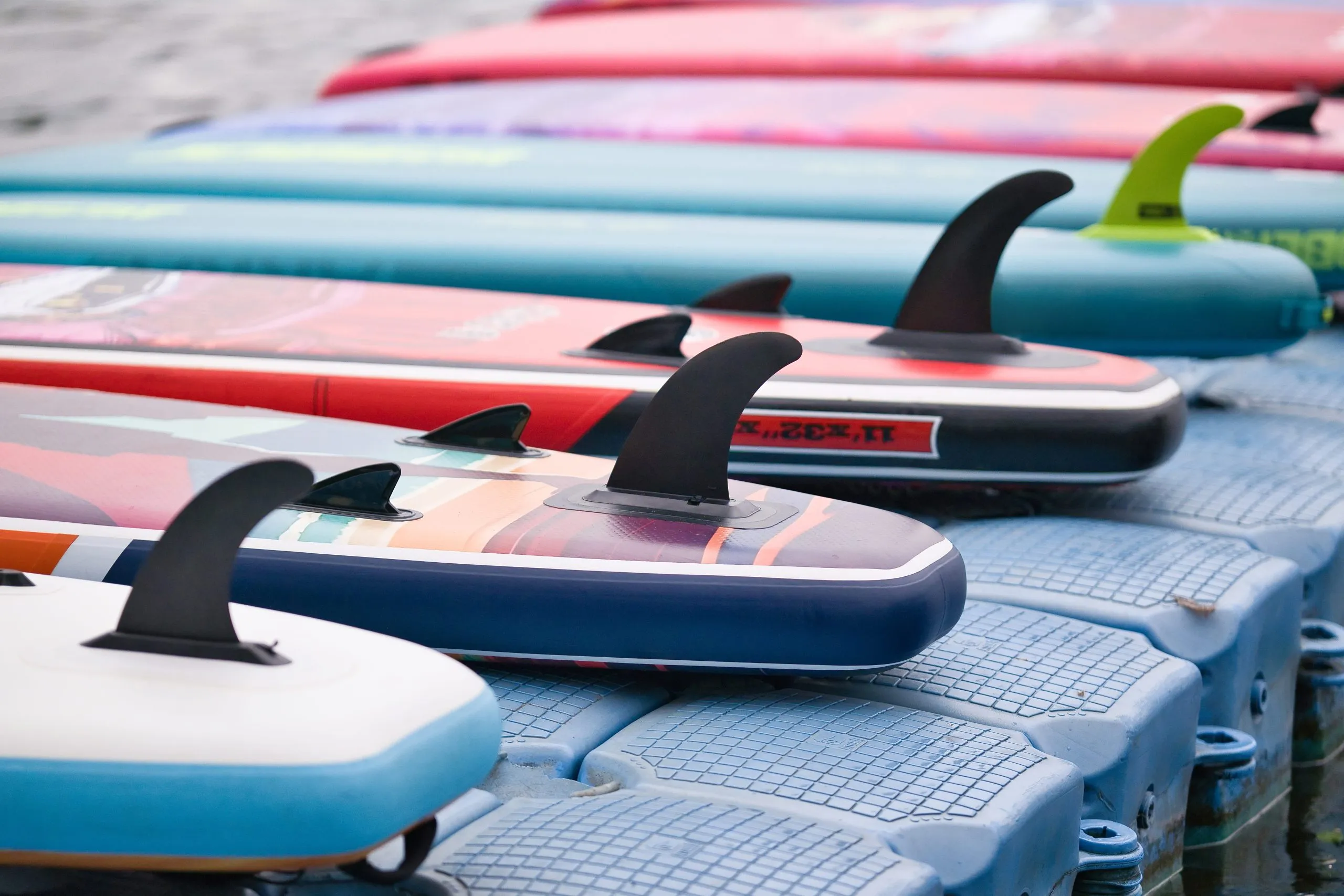 Philippines Surfing Equipment Market Outlook to 2035 many-different-sup-boards-water-sport-happy-active-summer-vacation-sup-boards-rent-1-scaled