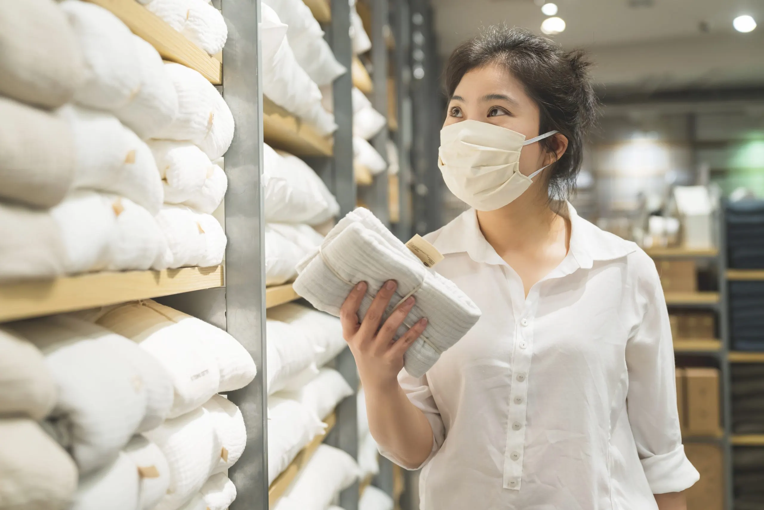 Philippines Adult Diaper Market Outlook to 2035 new-normal-after-covid-epidemic-young-smart-asian-female-shopping-new-lifestyle-storet-with-face-shild-mask-protection-hand-choose-consumer-products-new-normal-lifestyle-1-scaled