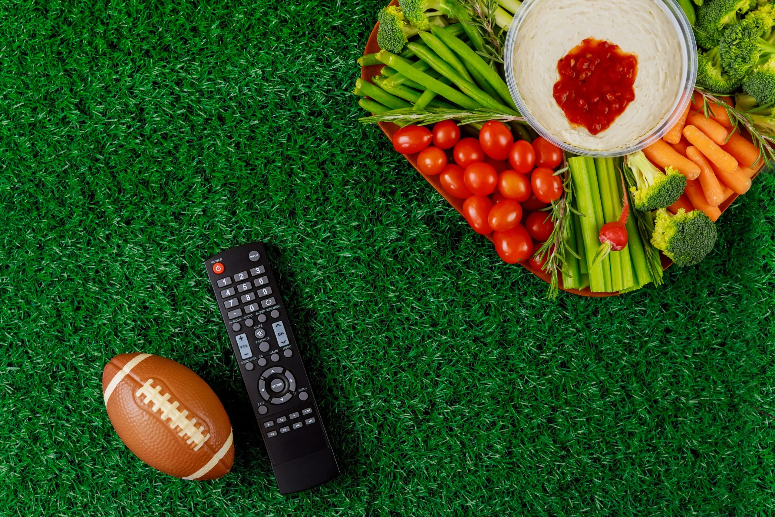 South Africa Artificial Turf Market Outlook to 2035 party-table-with-remote-control-sport-watching-american-football-game-tv-scaled