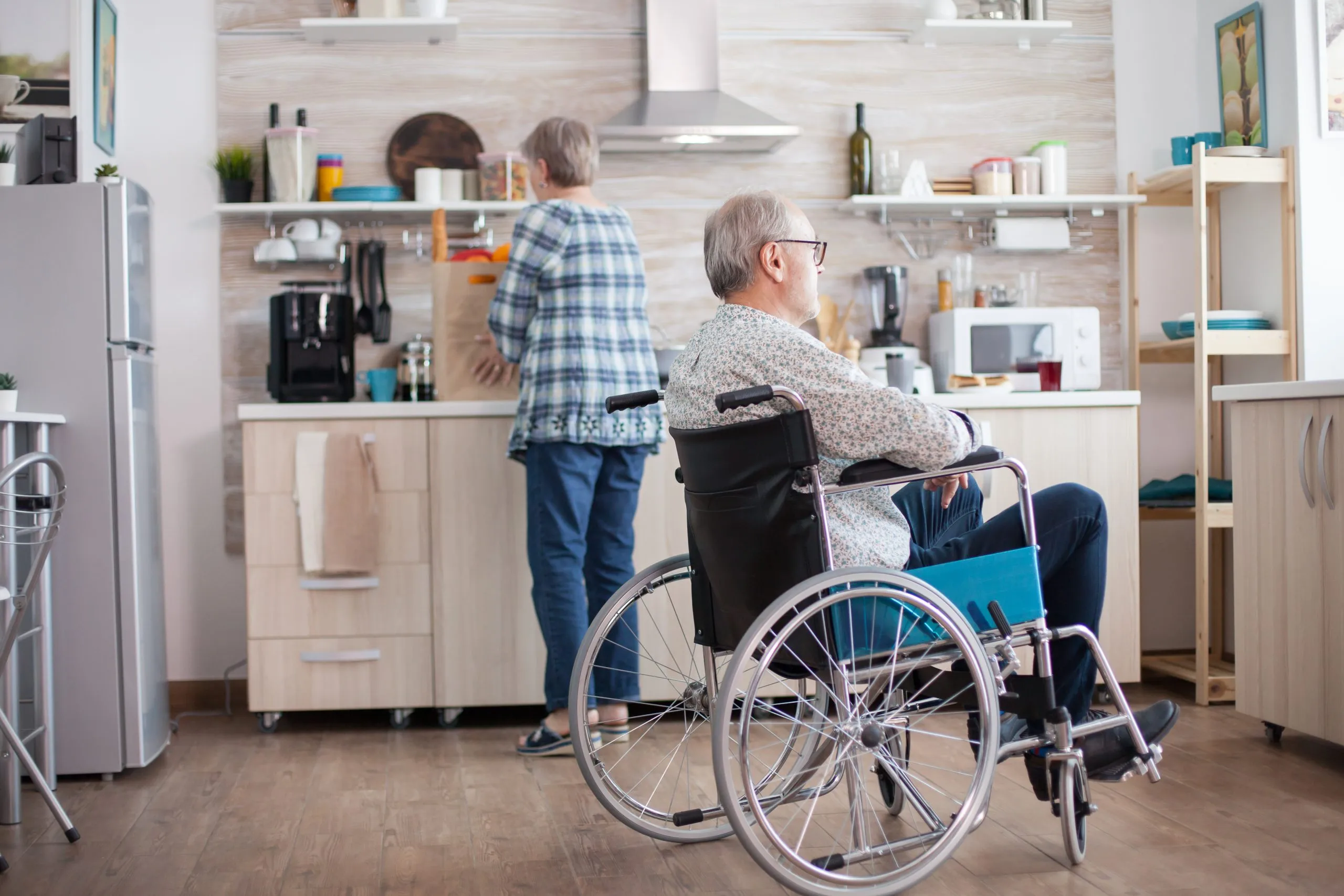 Understanding the Expansion of Home Care Services in Brazil with 8% Annual Growth and $4.5B Market Size pensive-disabled-elderly-person-wheelchair-looking-window-from-kitchen-disabled-man-sitting-wheelchair-kitchen-looking-through-window-while-wife-is-preparing-breakfast-invalid-p-scaled