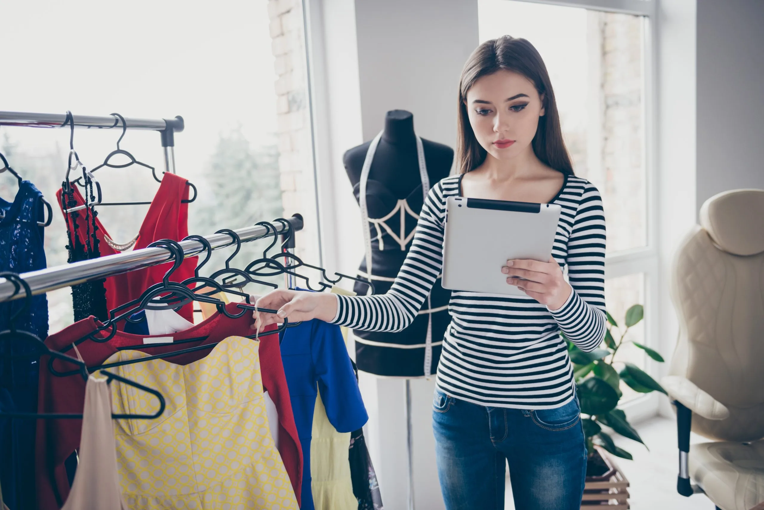 South Africa Online Clothing Rental Market Outlook to 2035 profile-side-view-portrait-skilled-seamstress-handling-client-order-choosing-dress-scaled