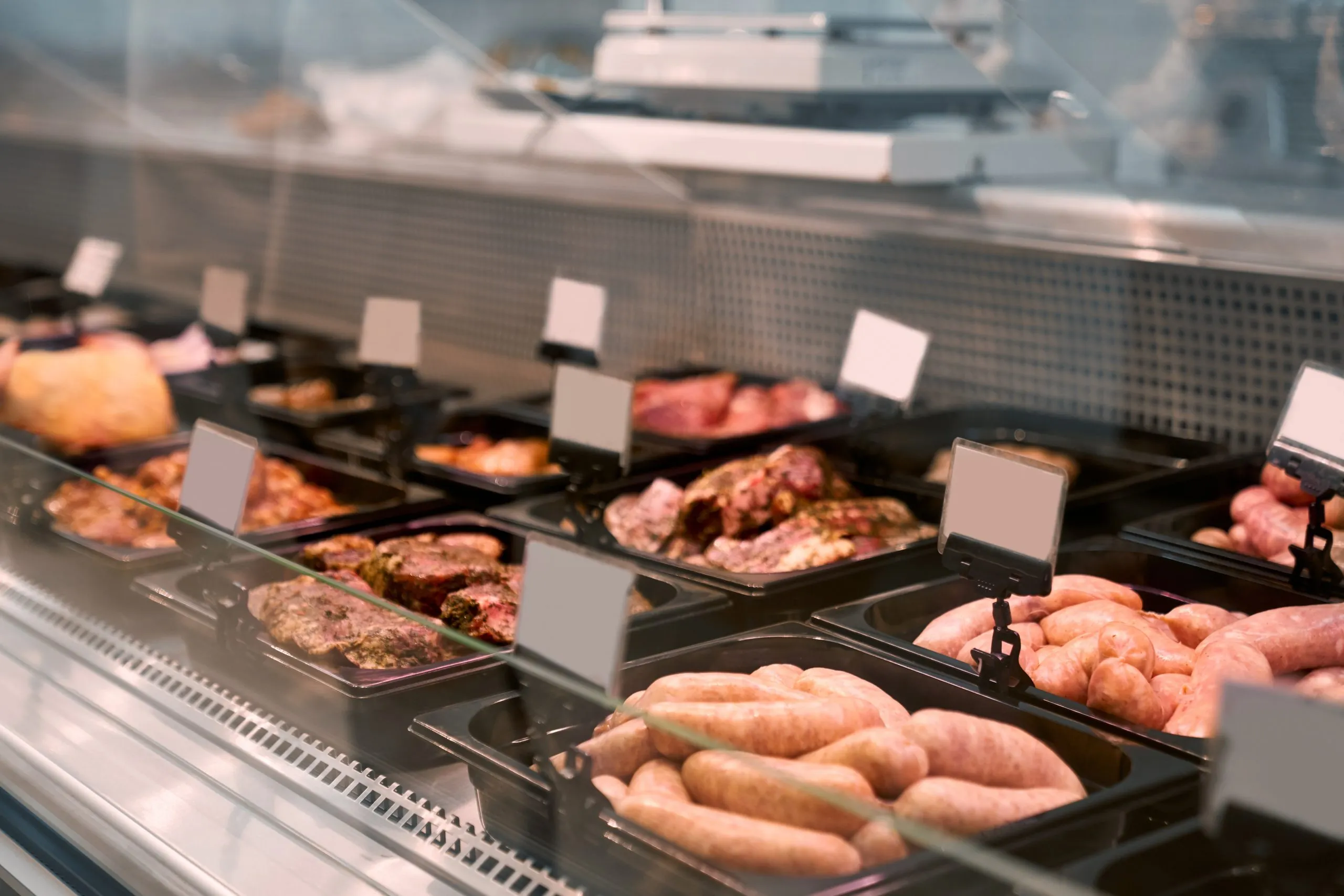 UAE Poultry Meat Market Outlook to 2035 raw-meat-products-glass-counter-scaled