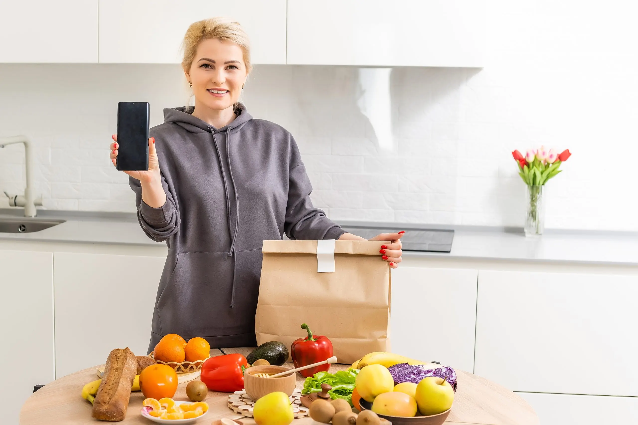 KSA Online Grocery Delivery Market Outlook to 2035 ready-quarantine-woman-holding-package-with-fresh-food-kitchen-staying-home-prevent-infection-scaled