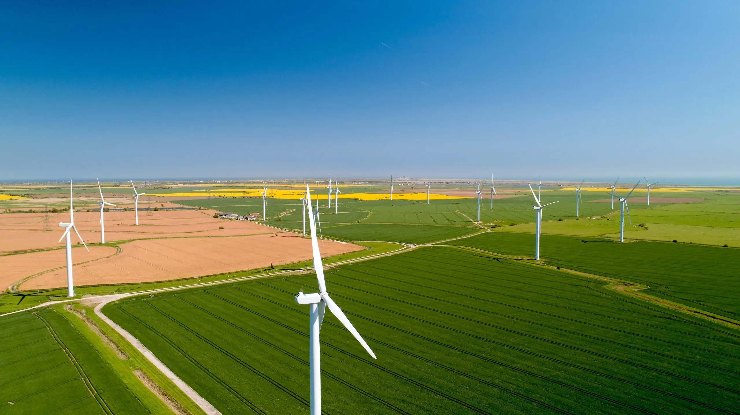 Italy Wind Energy Market Projected to Reach 20 GW and Lead in Renewable Growth scenic-view-agricultural-field-against-blue-sky-scaled