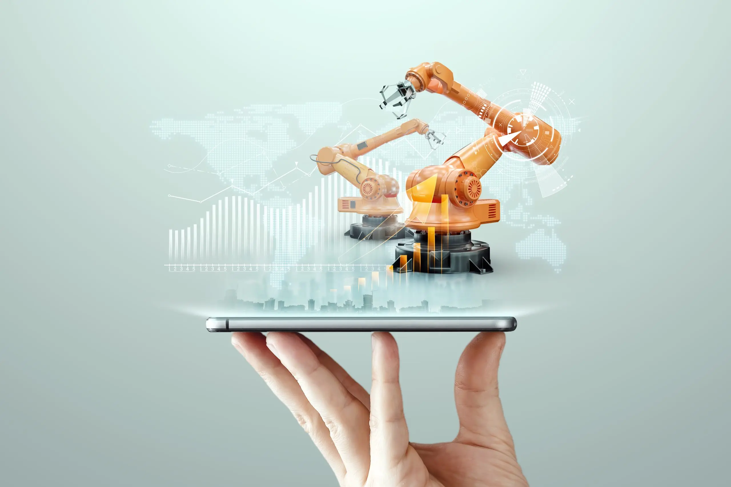 The Rise of Industrial Automation in the USA Market Set to Reach $40 Billion in the coming years smartphone-man-s-hand-robotic-arms-modern-plant-iot-technology-concept-smart-factory-digital-manufacturing-operation-industry-4-0-scaled