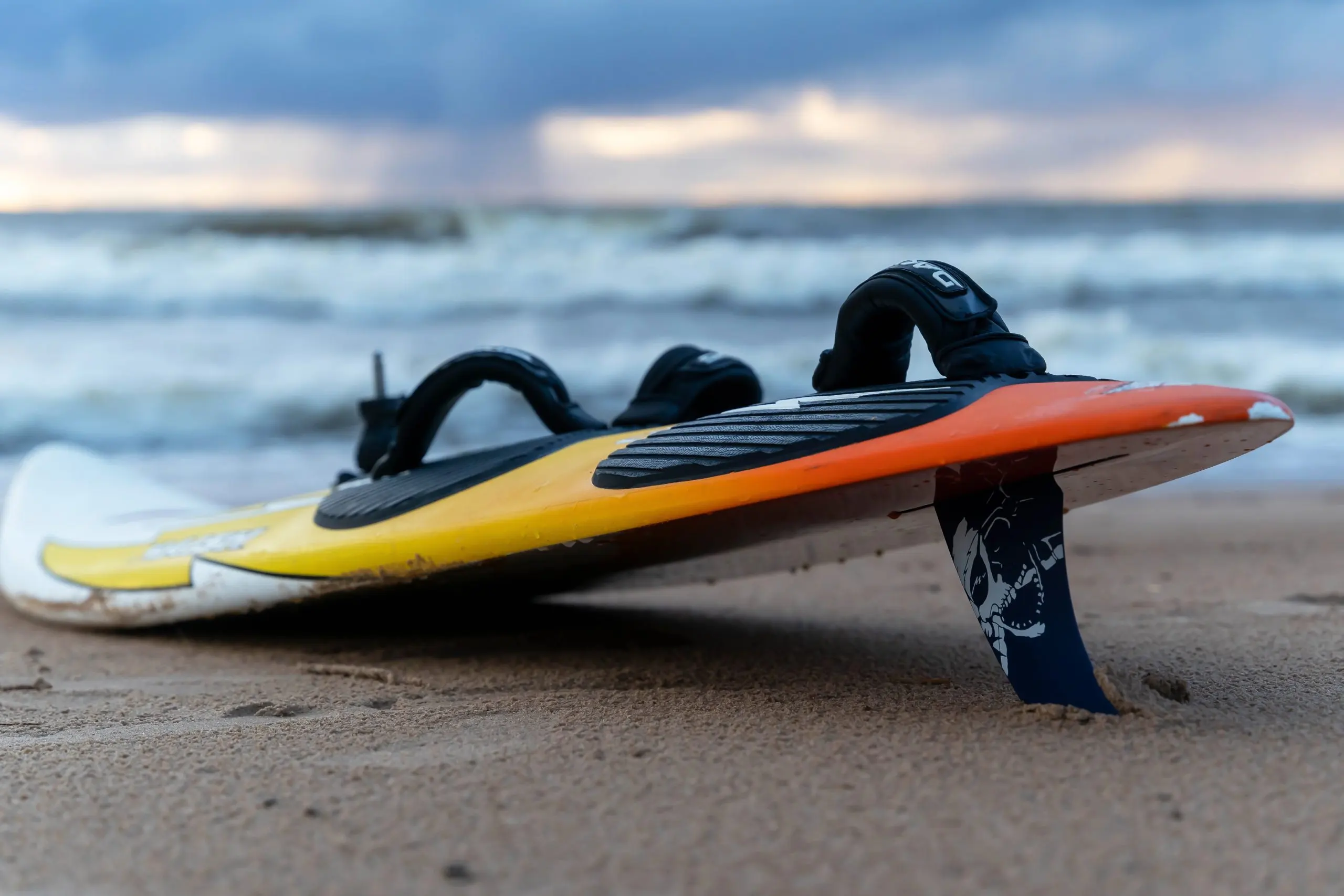 Singapore Surfing Equipment Market Outlook to 2035 sosnovy-bor-russia-october-15-2023-surfboard-lying-sand-beach-sea-waves-orange-surfboard-water-sports-active-lifestyle-scaled