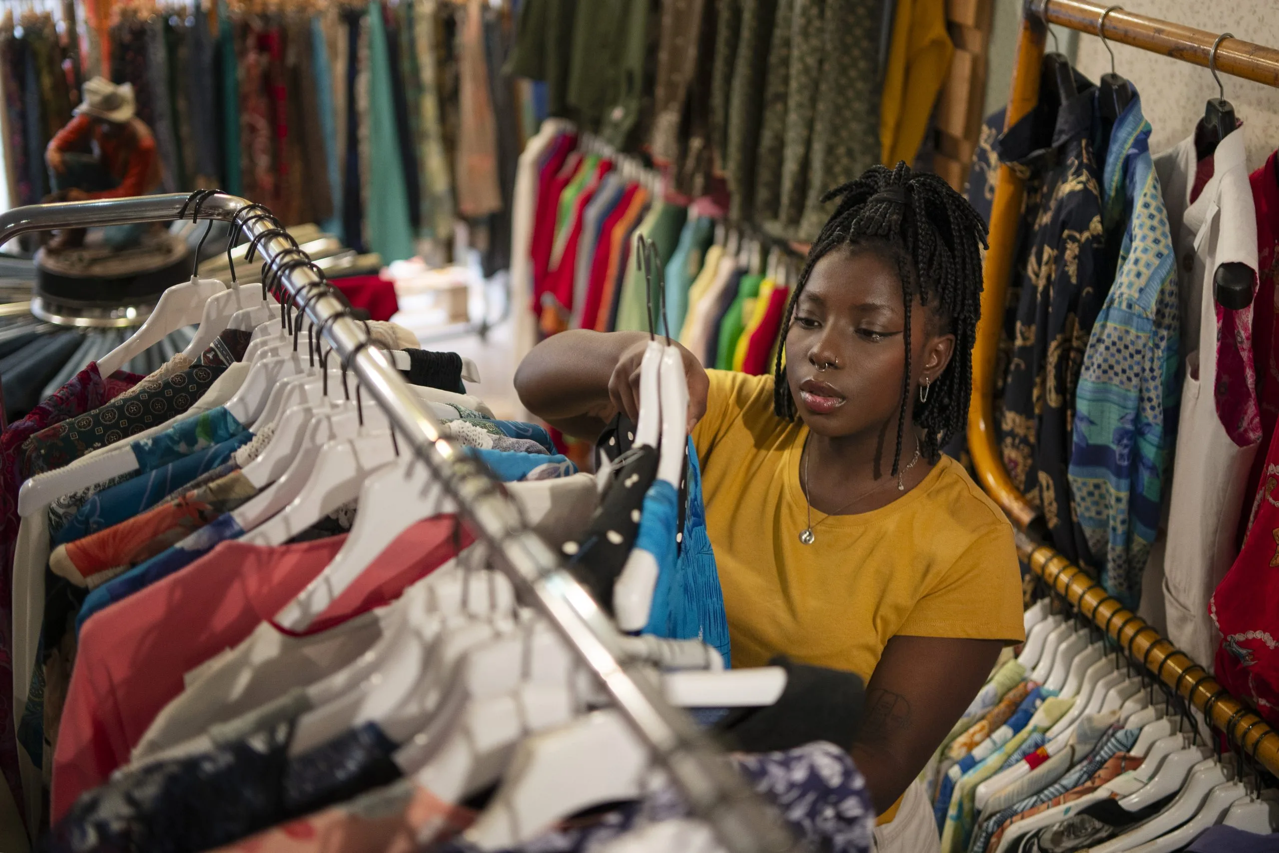 Nigeria Outdoor Apparel Market Outlook to 2035 woman-shopping-thrift-store-scaled