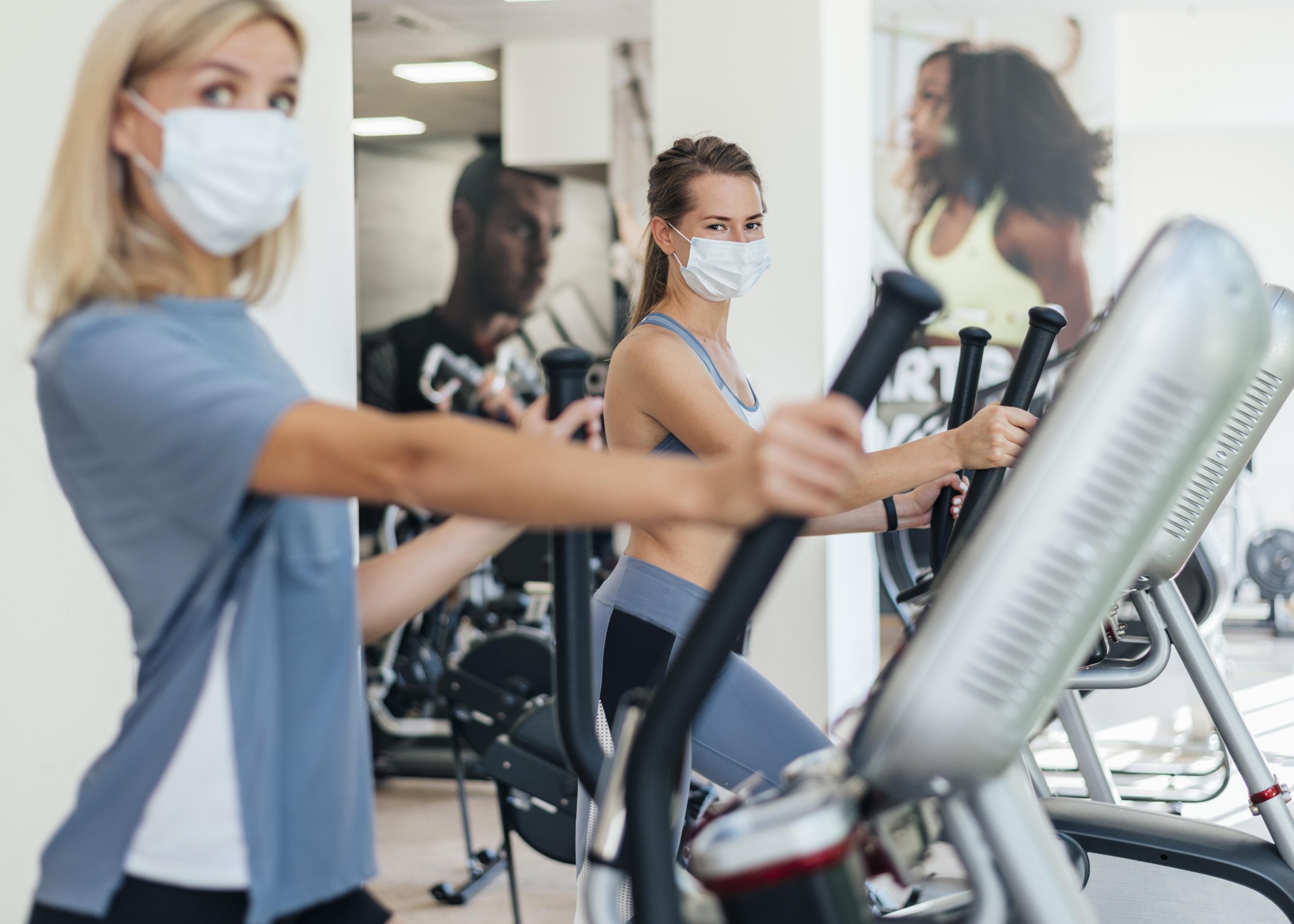 Saudi Arabia Health and Fitness Services Market Forecast Showing $2.5B Revenue and 10% CAGR Drivers Challenges and Growth women-exercising-gym-with-mask-scaled