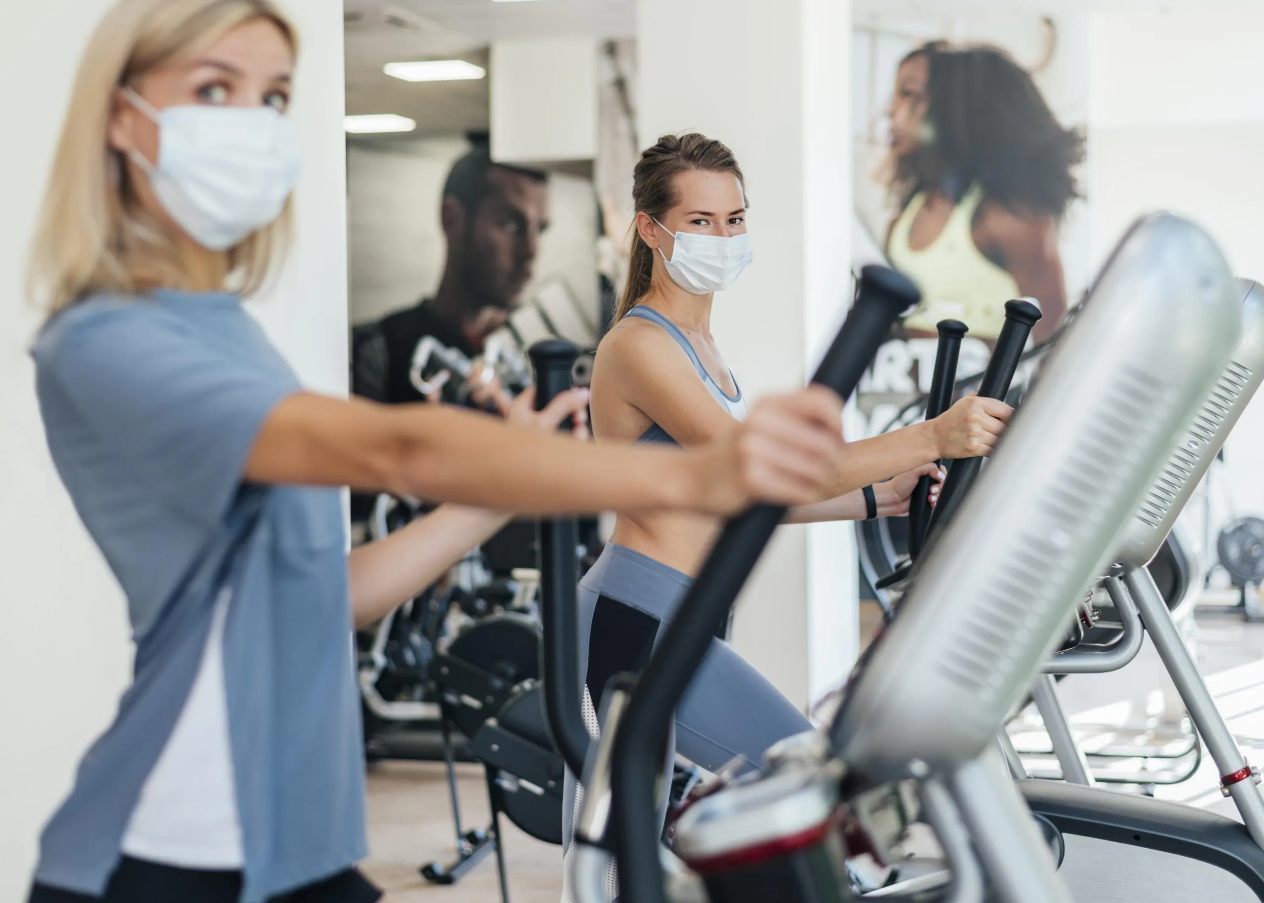 Saudi Arabia Health and Fitness Services Market Forecast Showing $2.5B Revenue and 10% CAGR Drivers Challenges and Growth women-exercising-gym-with-mask-scaled