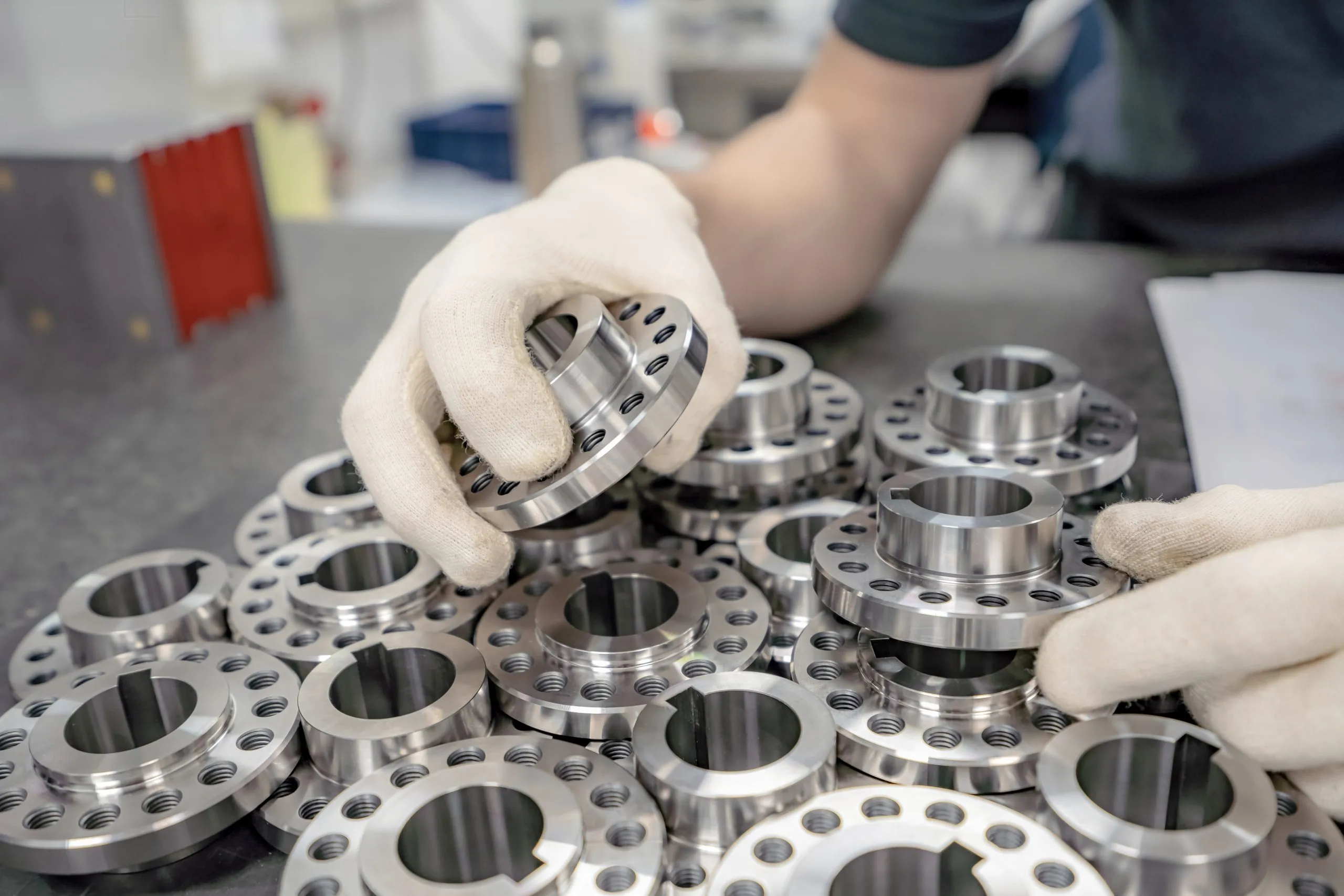 Philippines Clutches Market Outlook with Asia‑Pacific Leading Global Demand at 60 % Share worker-inspects-sorts-round-parts-with-holes-scaled