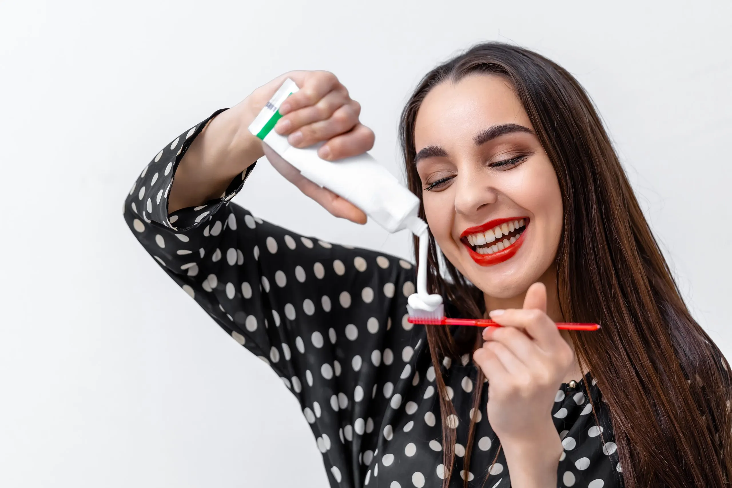 UAE Teeth Whitening Market Outlook to 2035 young-woman-holding-toothbrush-placing-toothpaste-it-dental-care-concept-scaled