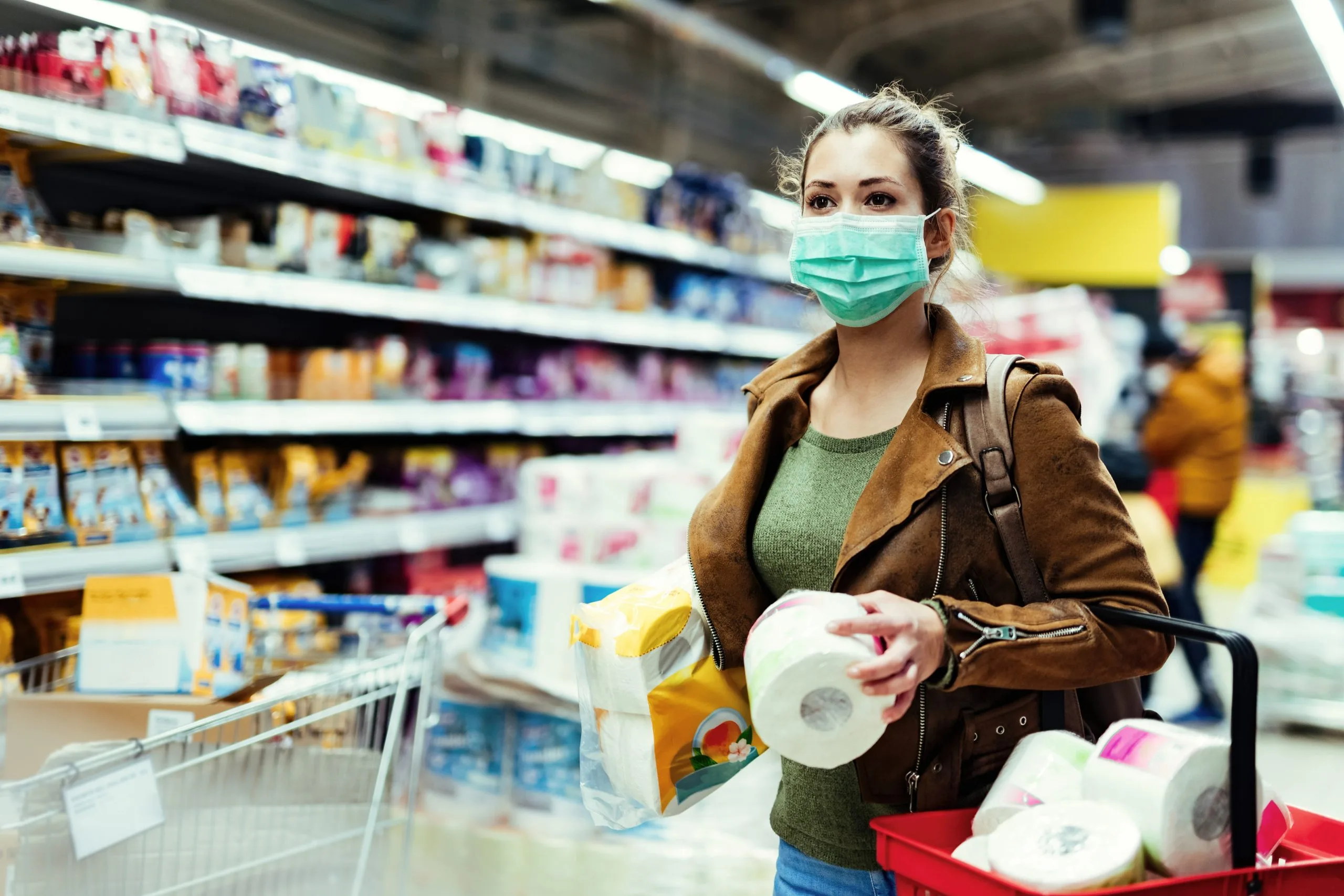 UK Oral Care Market Outlook to 2035 young-woman-with-protective-mask-shopping-toilet-paper-making-supplies-virus-pandemic-scaled