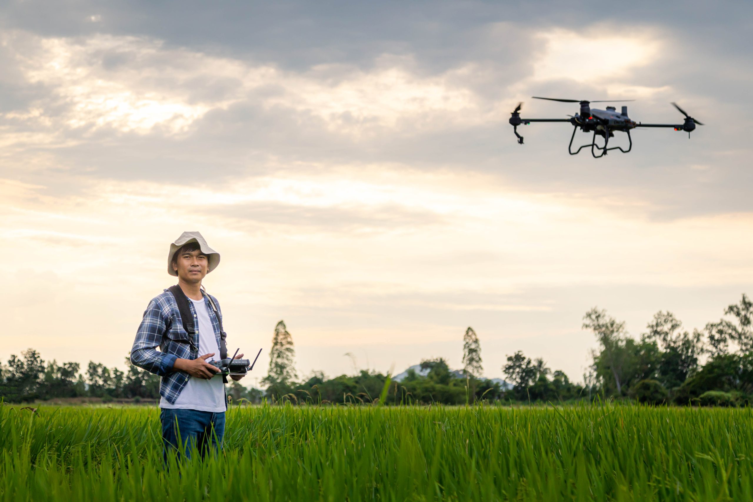 South Africa Agriculture Drones Market Outlook to 2035 agricultural-specialist-controls-agriculture-drone-with-remote-controller-spraying-fertilizer-pesticide-rice-field-agriculture-5g-smart-farming-smart-technology-concept-scaled