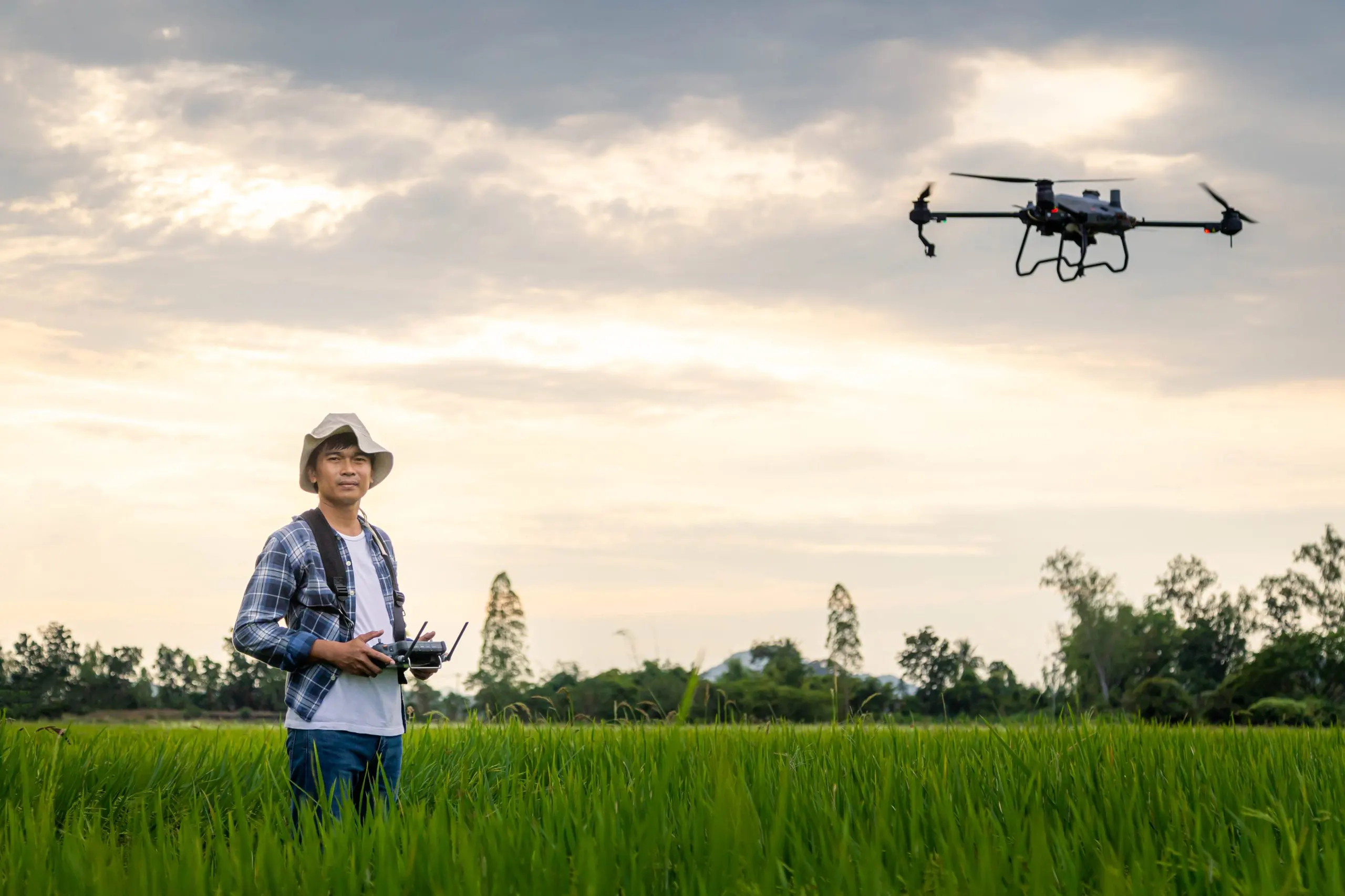 South Africa Agriculture Drones Market Outlook to 2035 agricultural-specialist-controls-agriculture-drone-with-remote-controller-spraying-fertilizer-pesticide-rice-field-agriculture-5g-smart-farming-smart-technology-concept-scaled