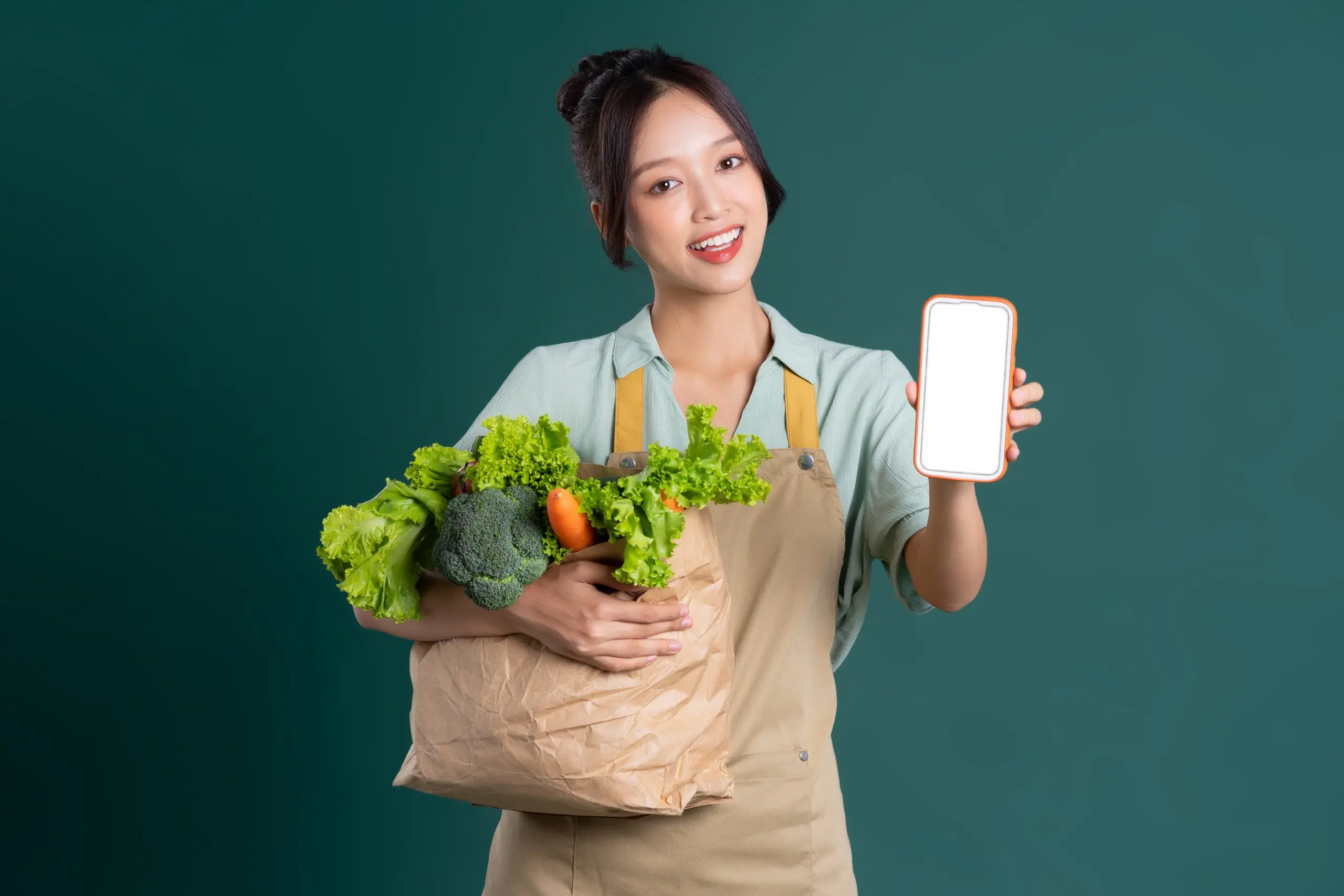 Vietnam Online Grocery Delivery Market Set to Reach $18 Billion Driven by Digital Adoption Boom asian-girl-portrait-holding-bag-vegetables-green-background-scaled