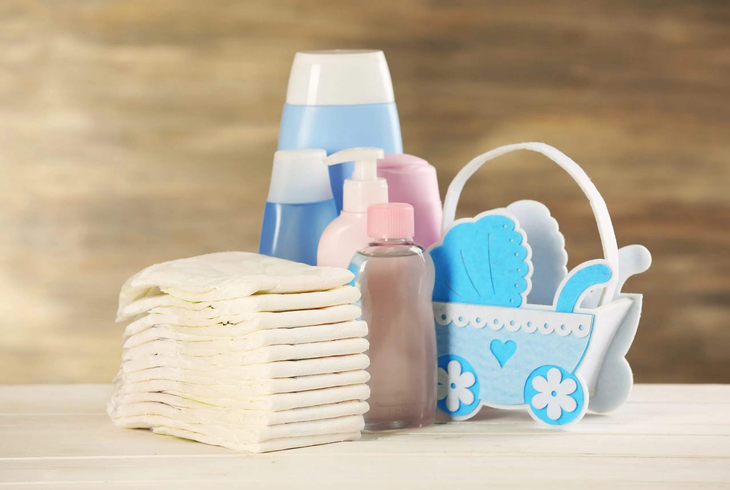 USA Baby Diapers Market Set to Grow at 4.3% CAGR Driven by Eco Friendly Diaper Demand baby-accessories-table-grey-background-scaled