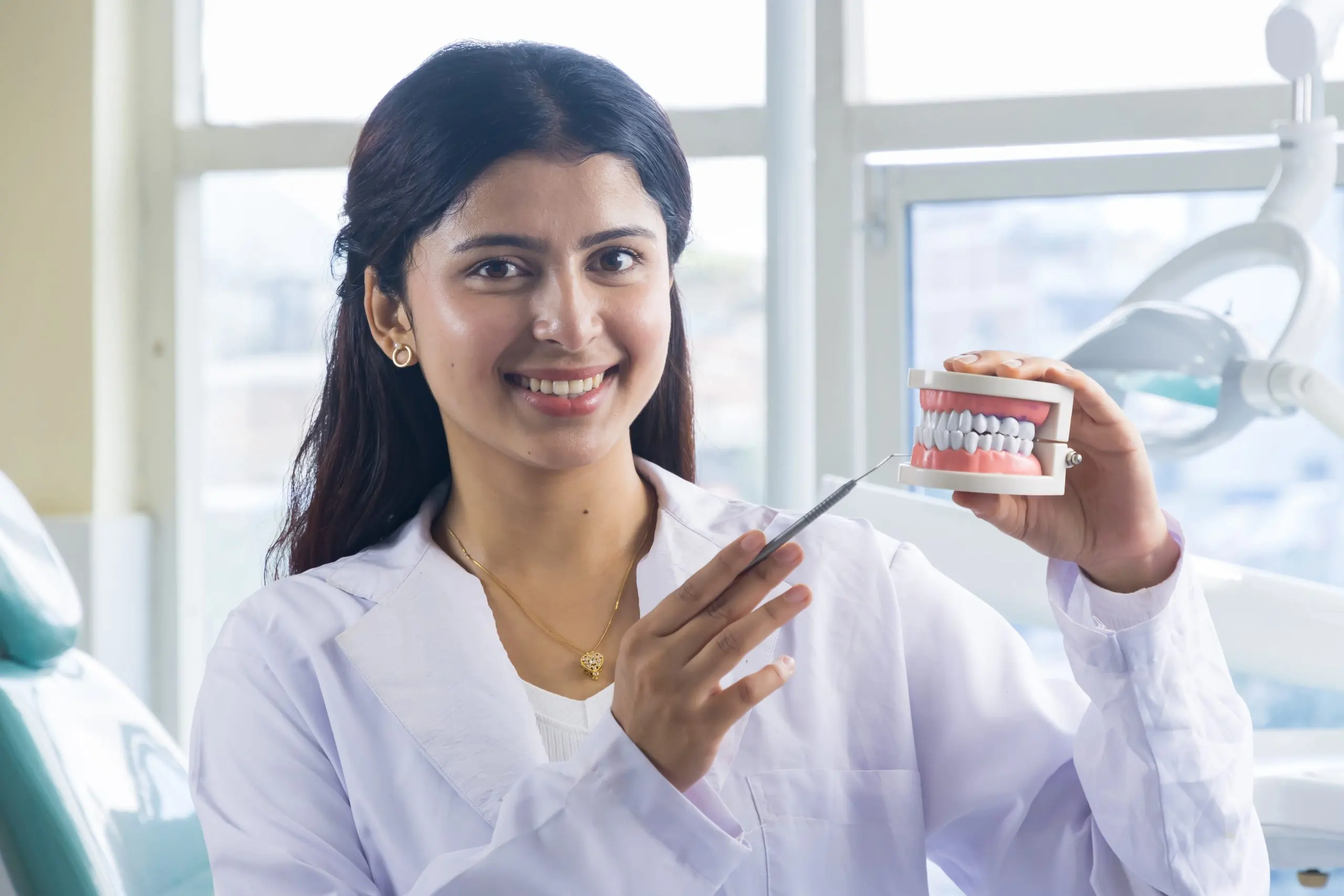 India Teeth Whitening Market Expands with Rising Demand Across USD 2 Billion Oral Care Industry beautiful-indian-looking-nepali-dentist-doctor-girl-smiling-giving-gestures-scaled